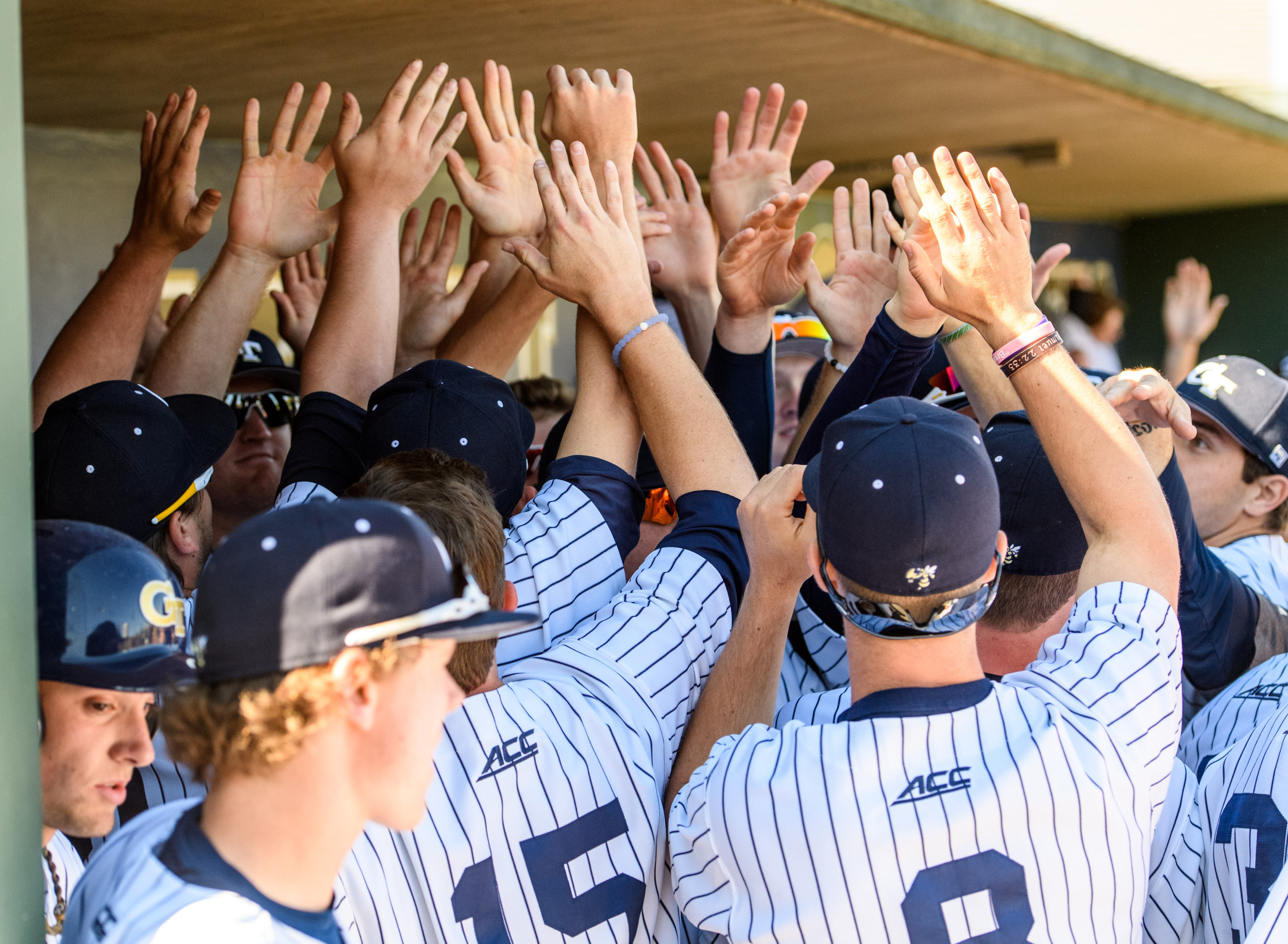 High-fives in the dugout