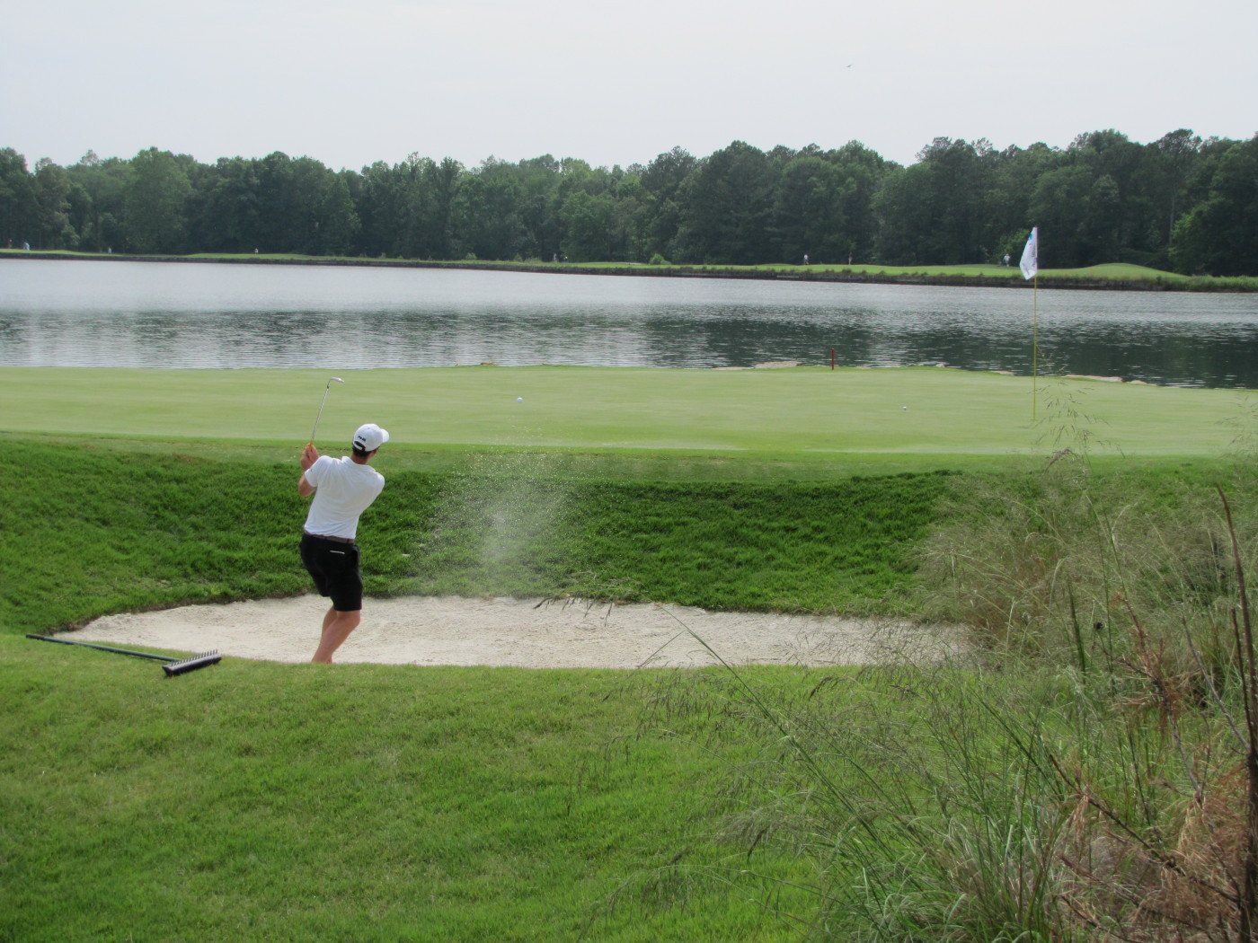 Kyle Scott pitches out of a greenside bunker during Round 1 of the 2010 NCAA Golf Championship, June 1, 2010.