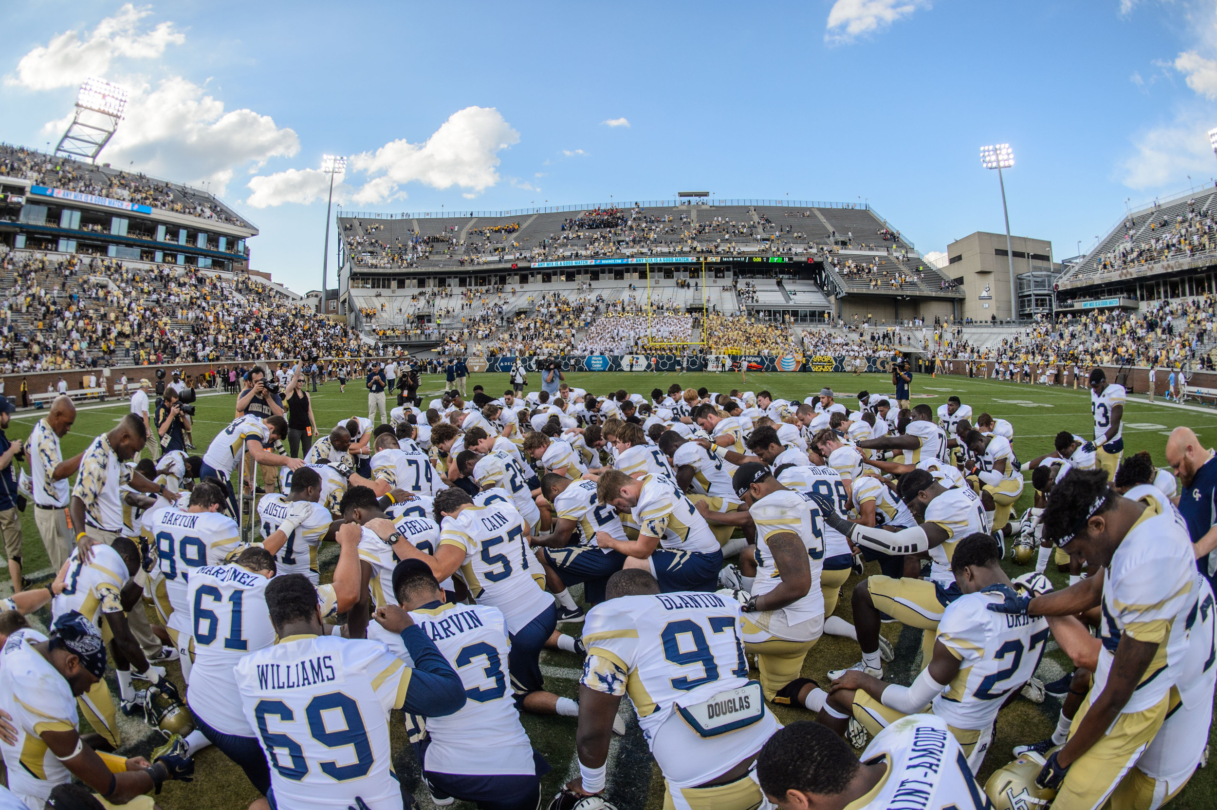 The team gathers at midfield after the win