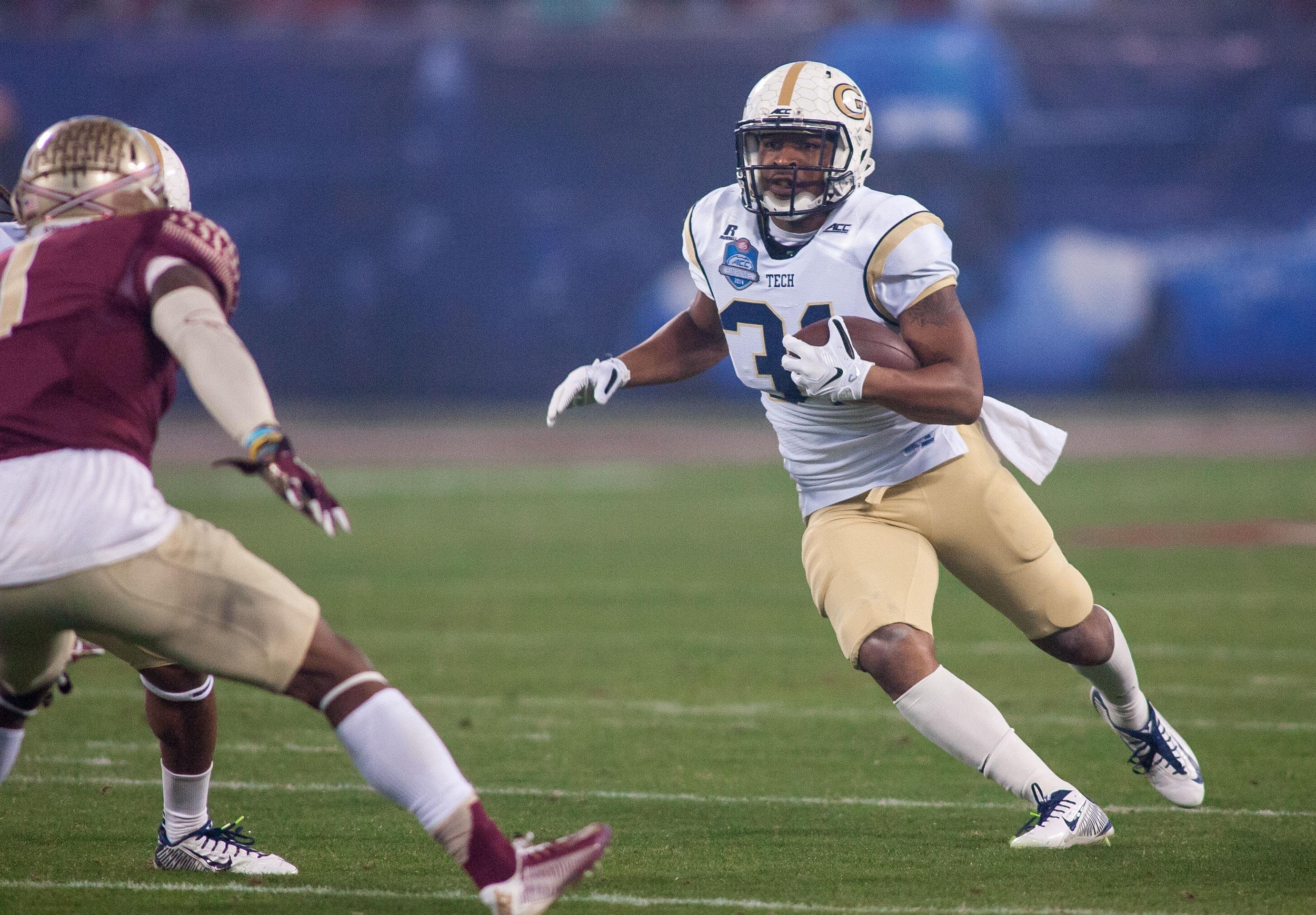 Dec 6, 2014; Charlotte, NC, USA; Georgia Tech Yellow Jackets running back Deon Hill (31) runs the ball during the first quarter against the Florida State Seminoles at Bank of America Stadium. Mandatory Credit: Jeremy Brevard-USA TODAY Sports