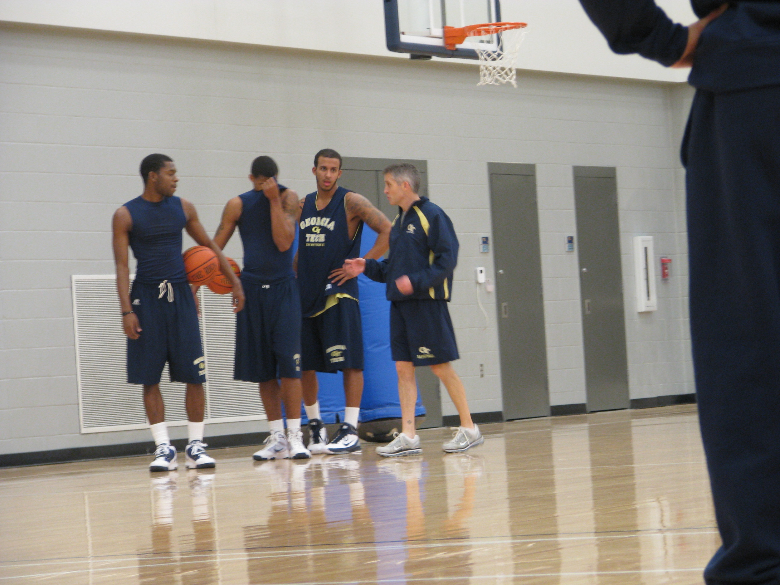 Head coach Brian Gregory puts the Yellow Jackets through individual workouts.