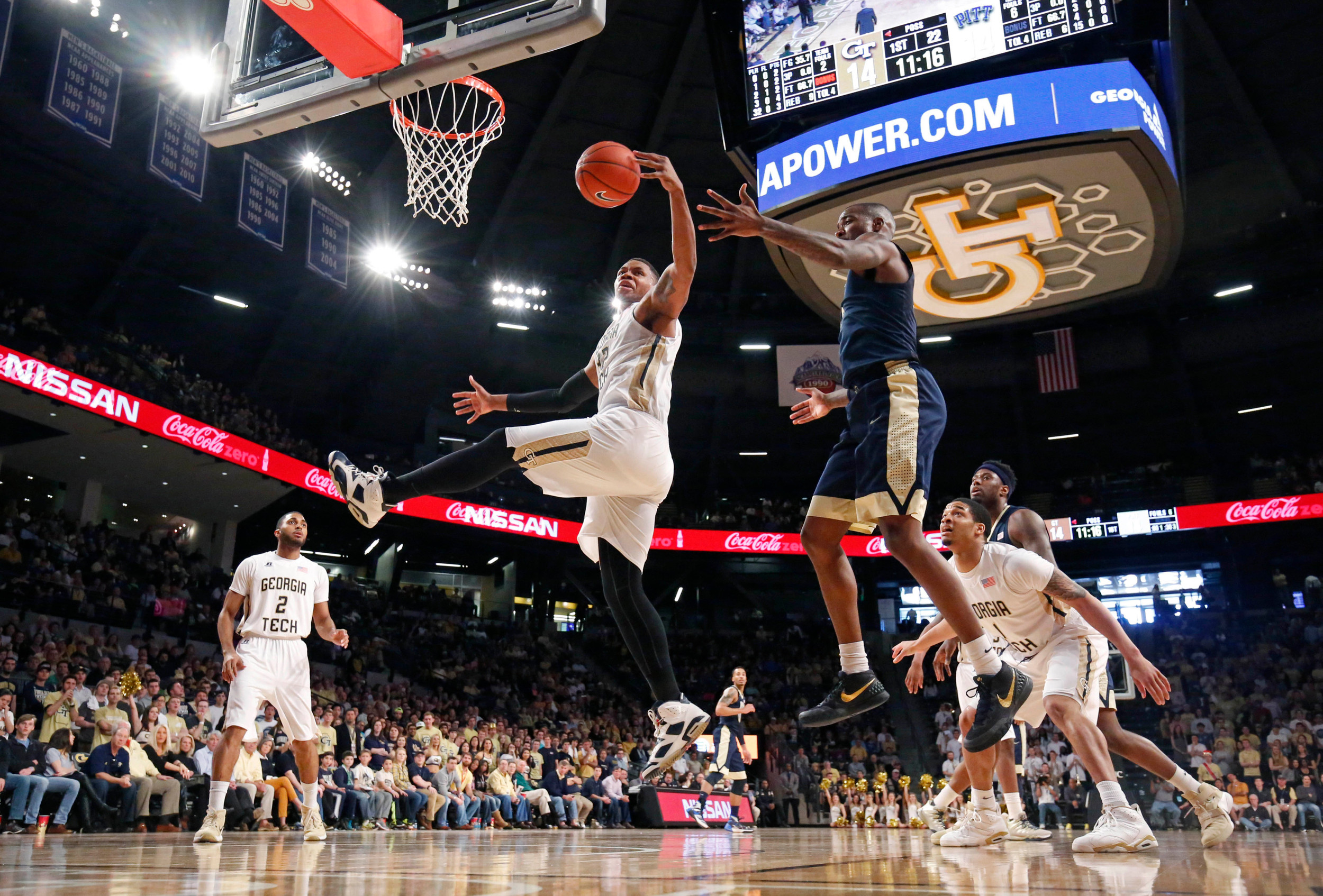 Mar 5, 2016; Atlanta, GA, USA; Georgia Tech Yellow Jackets forward Nick Jacobs (32) grabs a rebound against Pittsburgh Panthers forward Michael Young (2). Credit: Jason Getz-USA TODAY Sports
