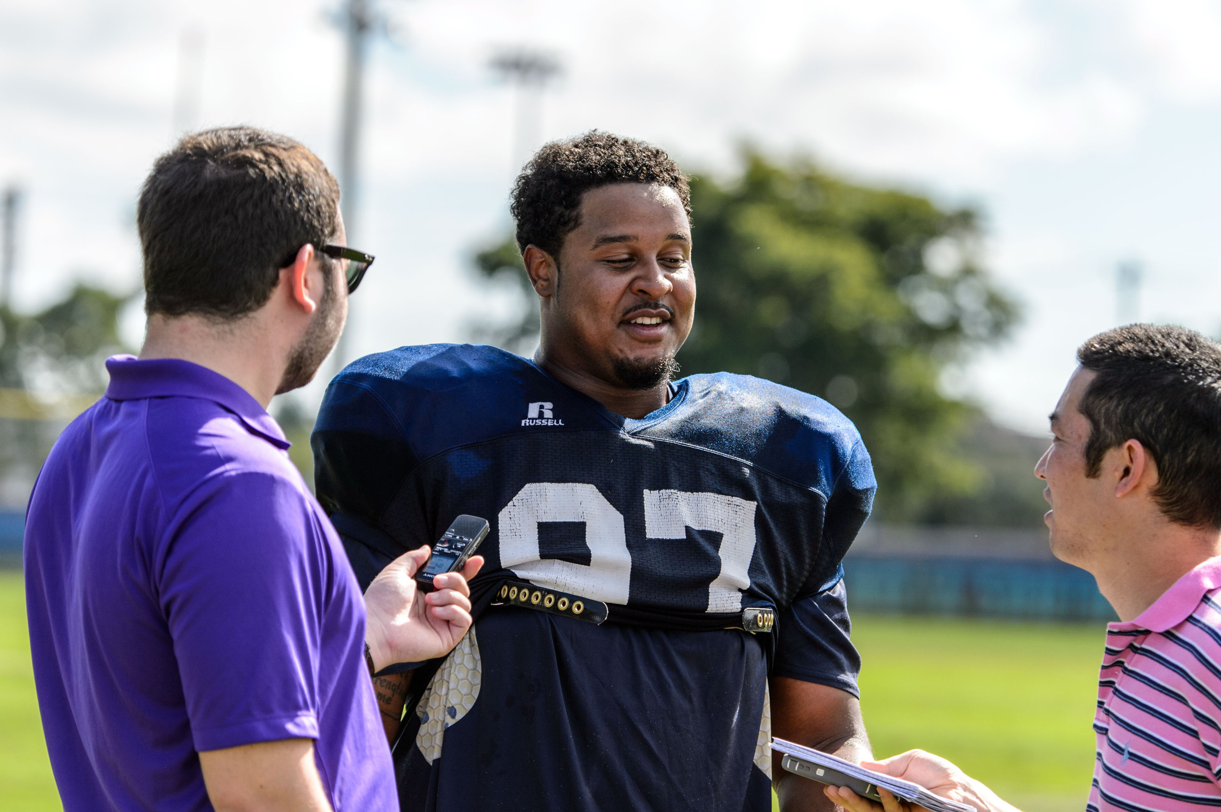 Shawn Green (97) talks with the media after practice
