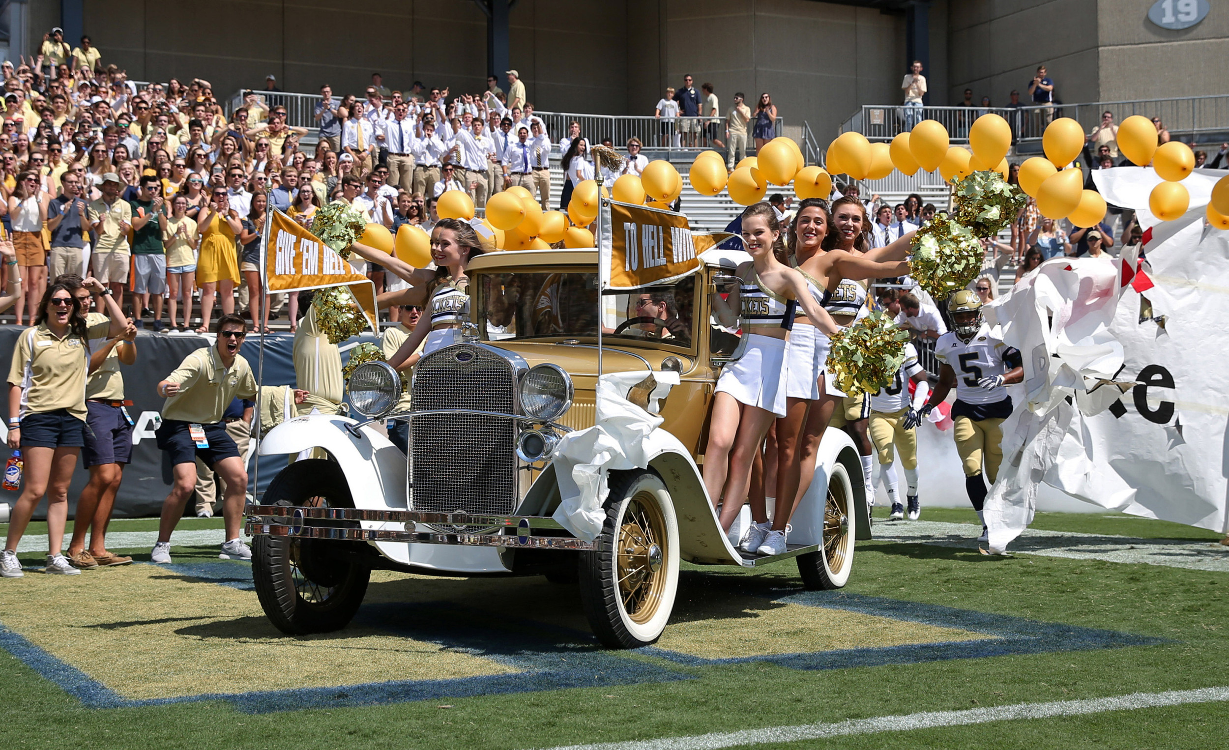 Yellow Jackets cheerleaders ride on the Ramblin Wreck before a game against the Jacksonville State Gamecocks at Bobby Dodd Stadium. Jason Getz-USA TODAY Sports