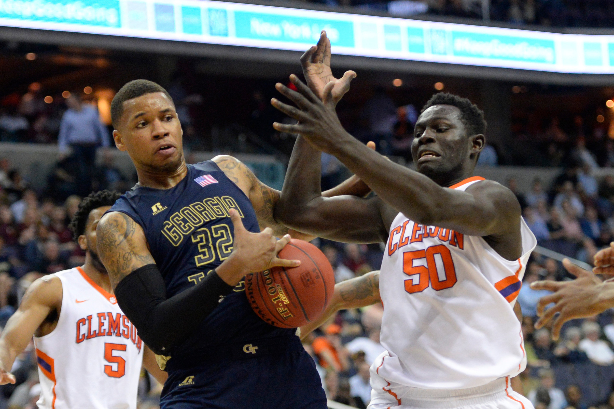 Mar 9, 2016; Washington, DC, USA; Georgia Tech Yellow Jackets forward Nick Jacobs (32) and Clemson Tigers center Sidy Djitte (50) battle for a loose ball in the second half during day two of the ACC conference tournament at Verizon Center. The Yellow Jackets won 88-85. Mandatory Credit: Tommy Gilligan-USA TODAY Sports