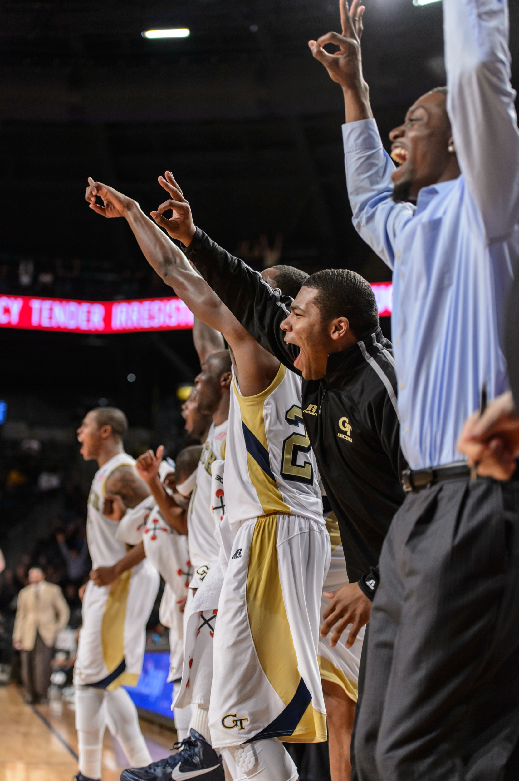 The bench reacts to Brooks Doyle's 3-pointer.