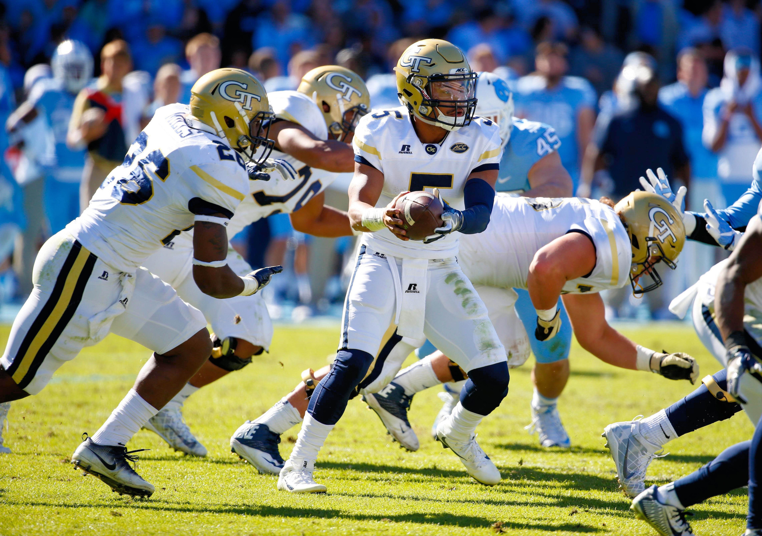 Yellow Jackets quarterback Justin Thomas (5) gets ready to hand off the ball during the second quarter against the North Carolina Tar Heels at Kenan Memorial Stadium. Credit: James Guillory-USA TODAY Sports