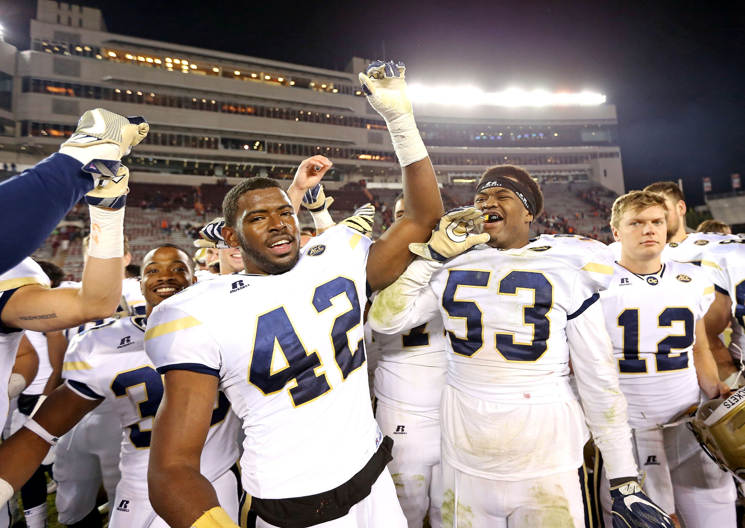 Blacksburg, VA; Georgia Tech Yellow Jackets defensive end KeShun Freeman and linebacker Chris Dandaneau celebrates after beating the Virginia Tech Hokies at Lane Stadium. Credit: Peter Casey-USA TODAY Sports