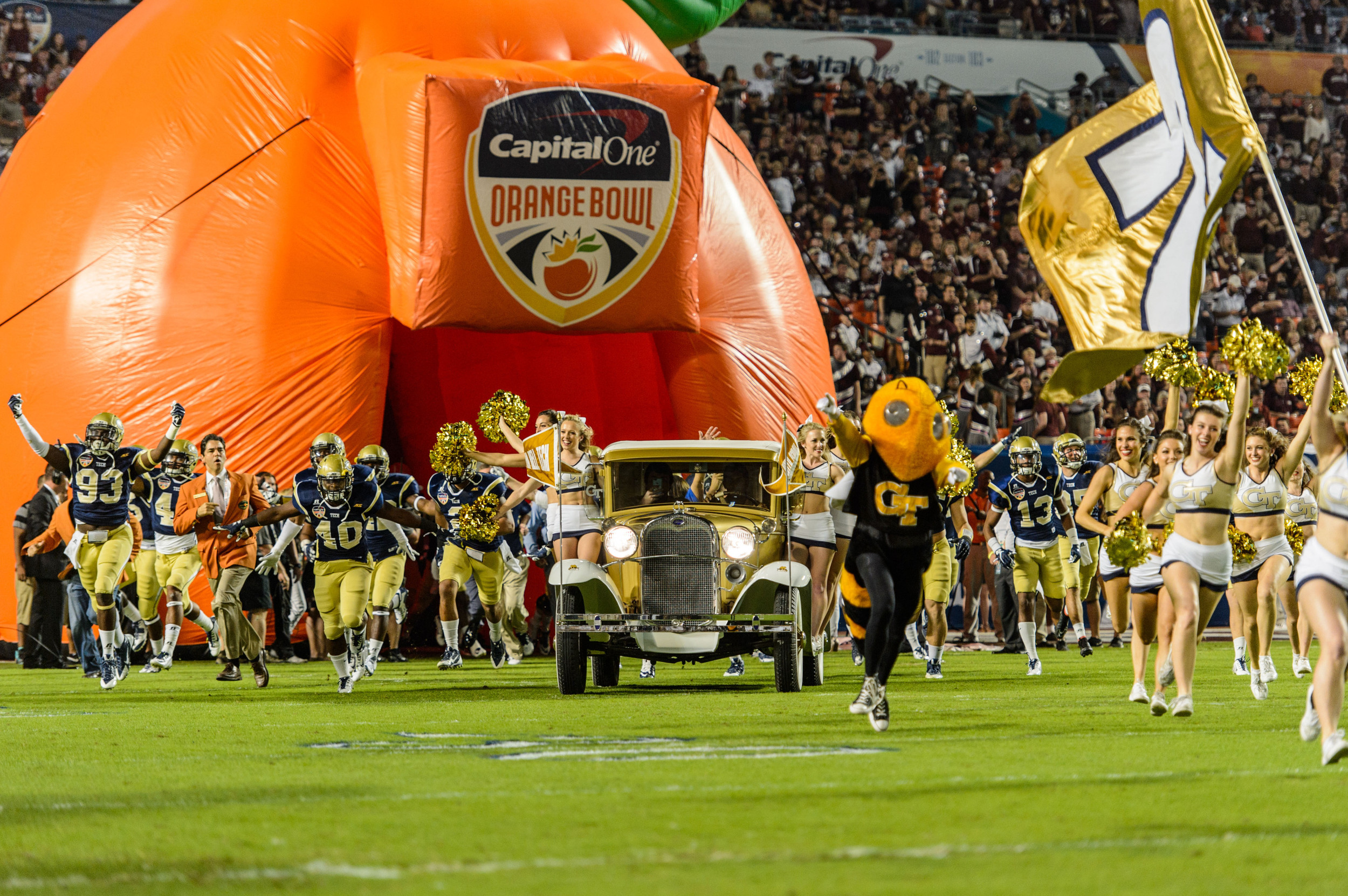 The Ramblin' Wreck leads the team onto the field