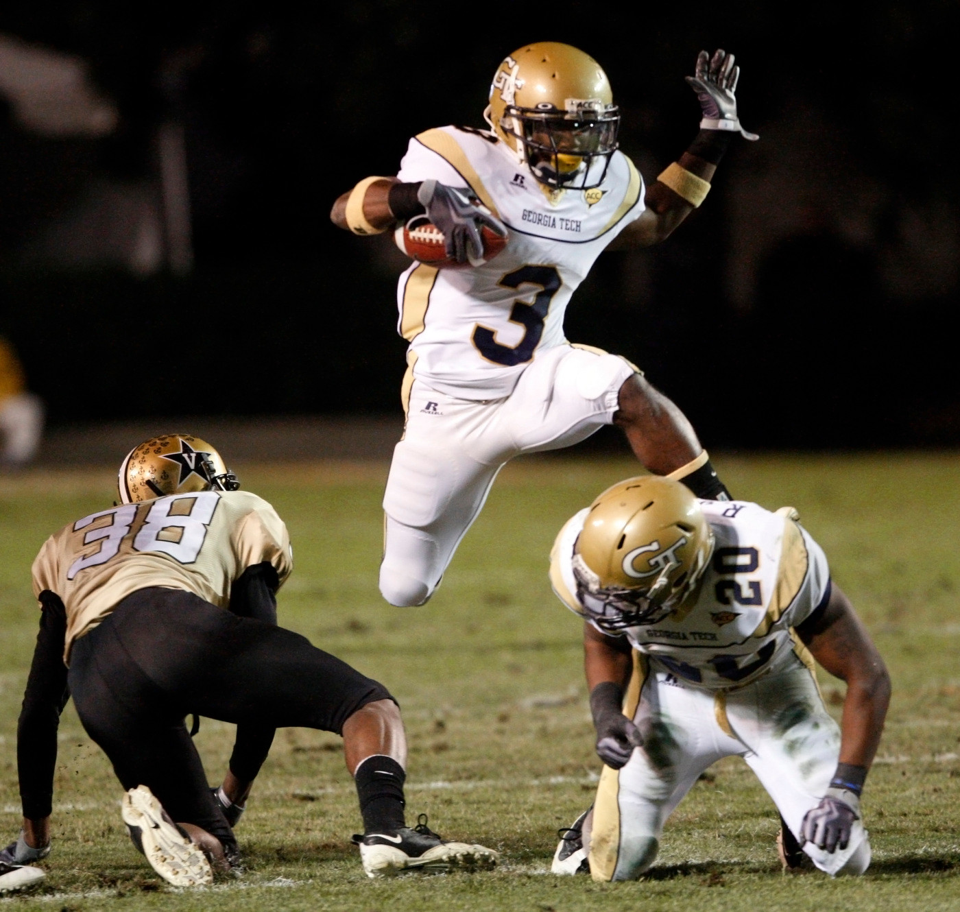 Georgia Tech running back Marcus Wright (3) hurdles teammate Roddy Jones (20) as Wright carries the ball against Vanderbilt in the first quarter. (AP Photo/Mark Humphrey)