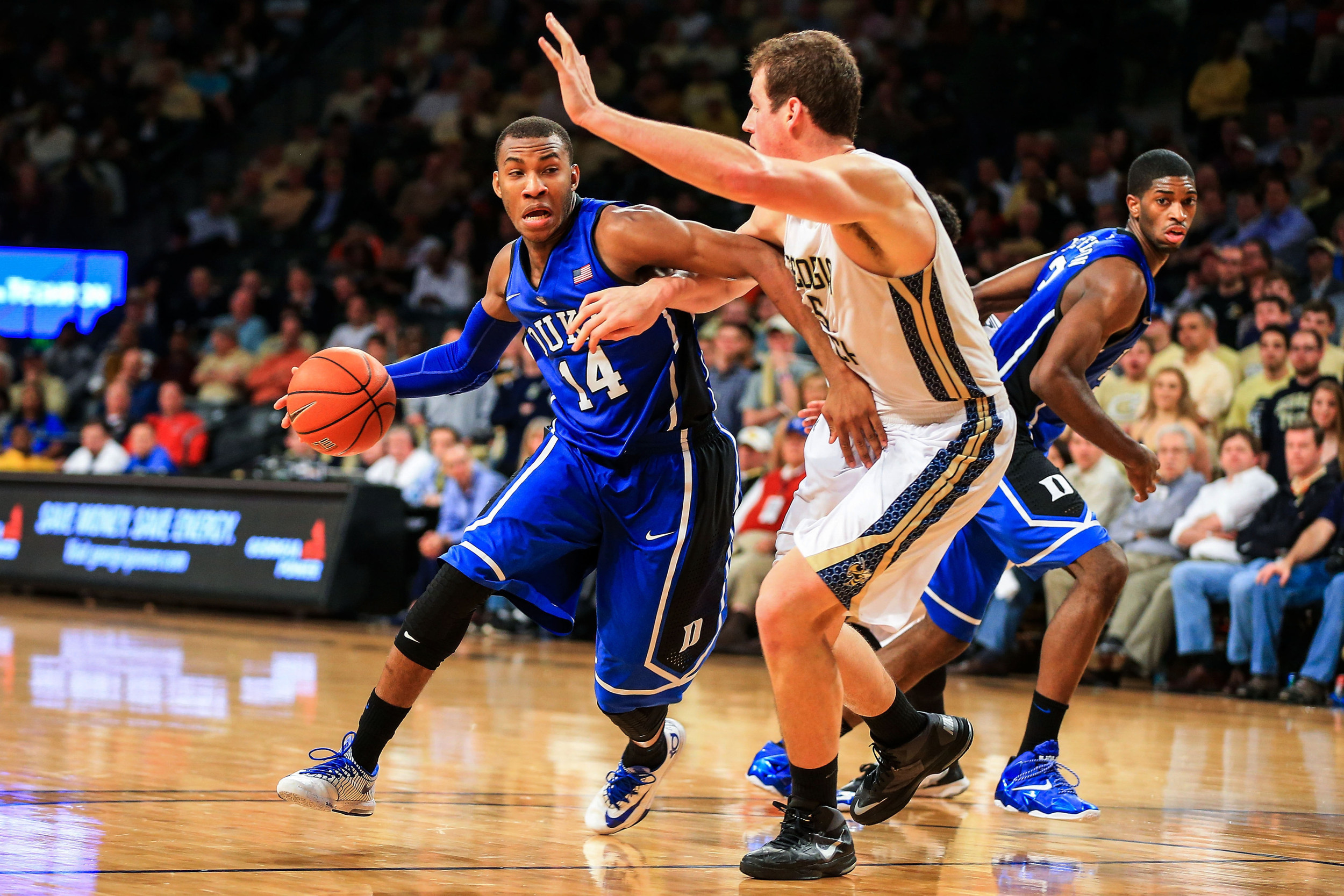 Feb 18, 2014; Atlanta, GA, USA; Duke Blue Devils guard Rasheed Sulaimon (14) drives to the basket against Georgia Tech Yellow Jackets center Daniel Miller (5) in the second half at Hank McCamish Pavilion. Duke won 68-51. Mandatory Credit: Daniel Shirey-USA TODAY Sports