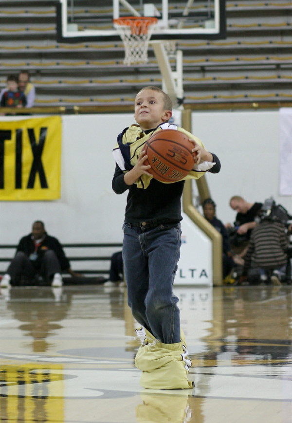 A fan participates in a contest during a timeout
