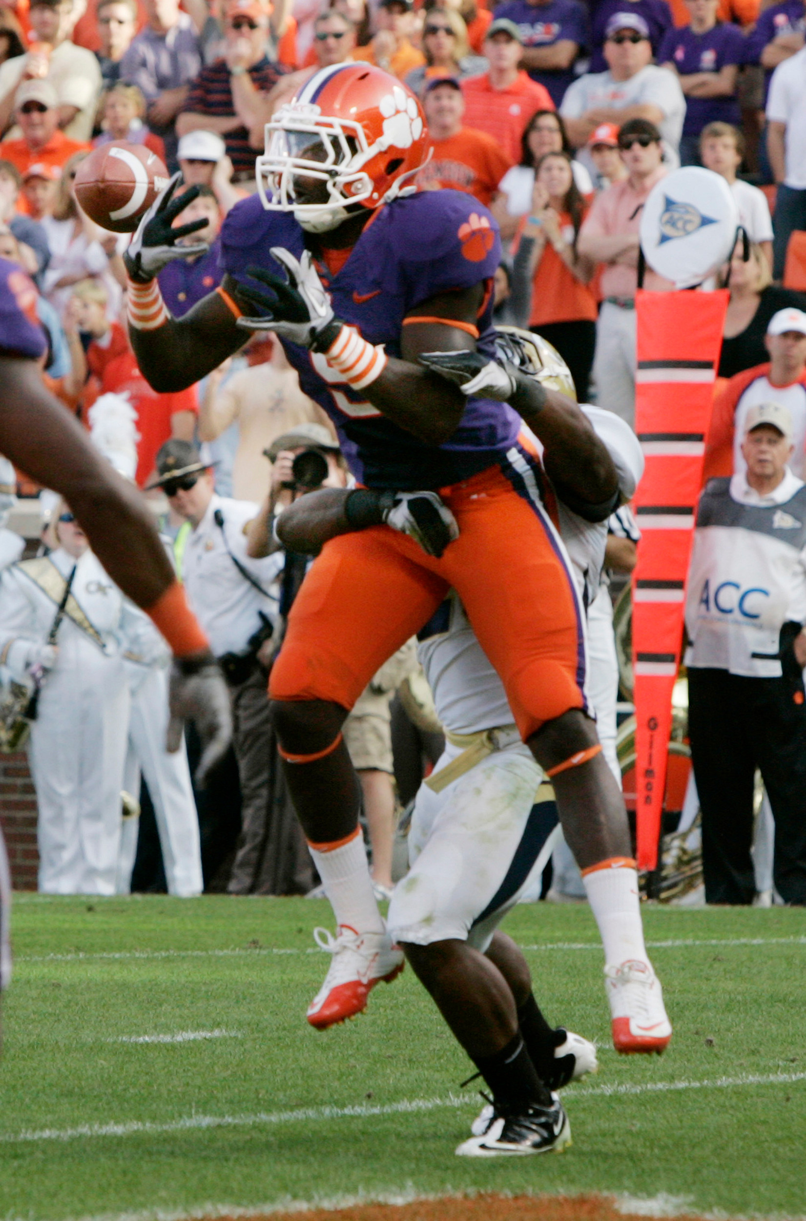Georgia Tech's intended receiver Roddy Jones, rear, prevents an interception by Clemson's Jonathan Meeks (5). (AP Photo/Mary Ann Chastain)