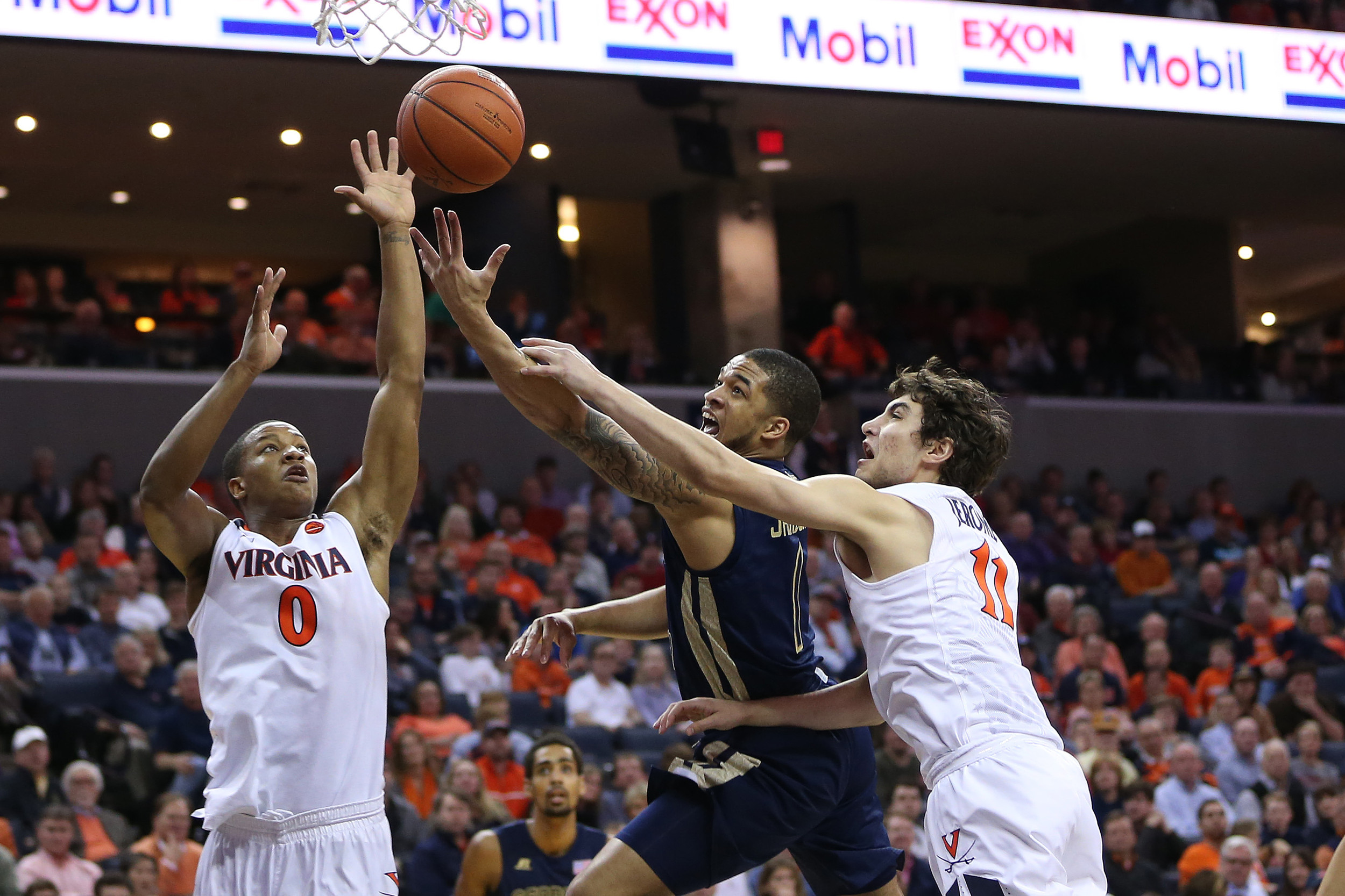 Georgia Tech Yellow Jackets guard Tadric Jackson (1) attempts to shoot the ball as Virginia Cavaliers guard Ty Jerome (11) and guard Devon Hall (0) defend during the first half at John Paul Jones Arena. (Amber Searls-USA TODAY Sports)
