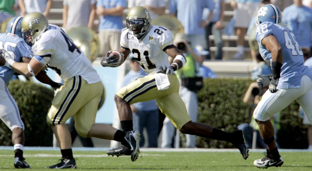Georgia Tech's Calvin Johnson (21) gets a block from Mike Cox, left, as North Carolina's Durell Mapp (48) chases during the first half of a college football game in Chapel Hill, N.C., Saturday, Nov. 11, 2006. (AP Photo/Gerry Broome)