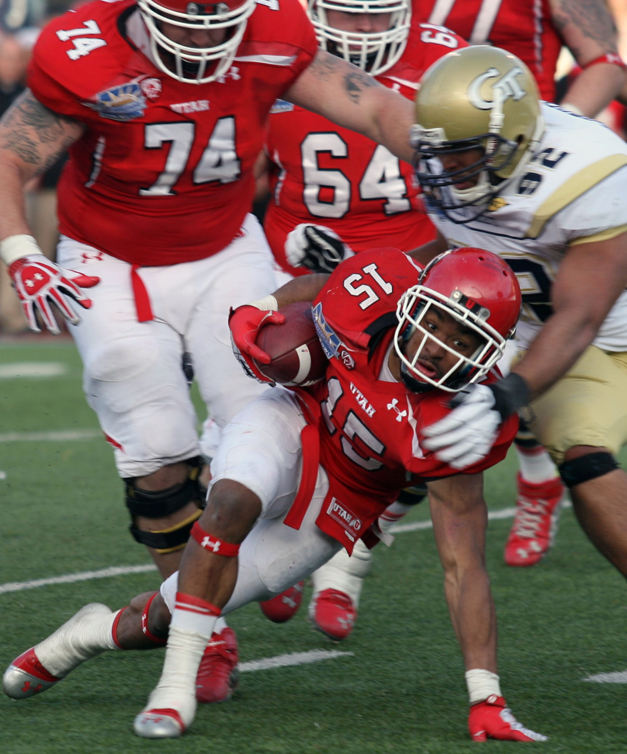 Utah's John White, bottom, struggles to reach the goal line as Georgia Tech's Jason Peters brings him down during overtime the Sun Bowl NCAA college football game on Saturday, Dec. 31, 2011, in El Paso, Texas. Utah won 30-27 in overtime. (AP Photo/El Paso Times, Victor Calzada) EL DIARIO OUT; JUAREZ MEXICO OUT; IF USE ON LAM OR LAT AND EL DIARIO DE EL PASO OUT