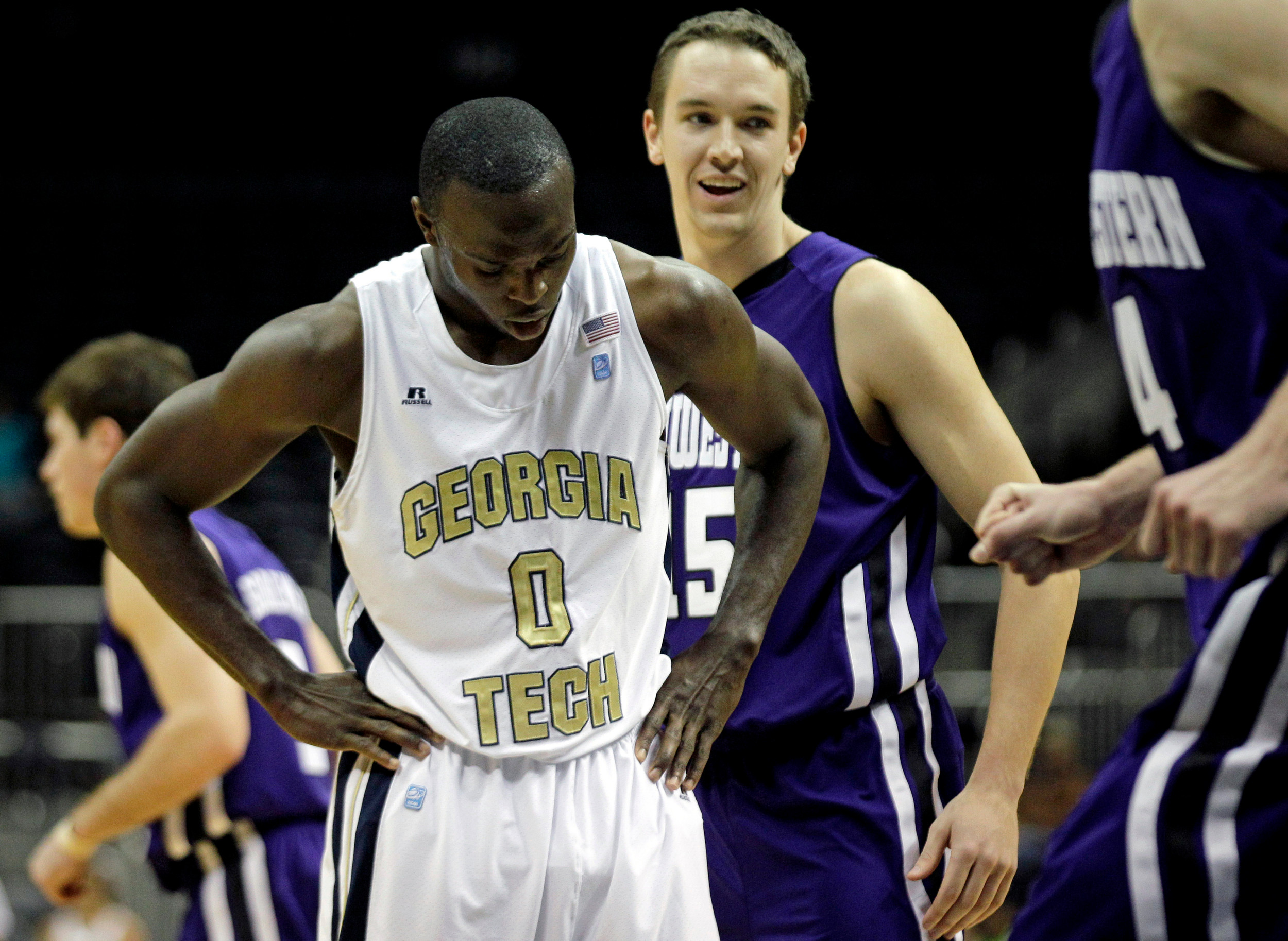 Georgia Tech guard Mfon Udofia reacts after missing a free throw as Northwestern guard Nick Fruendt, rear, looks on. (AP Photo/David Goldman)