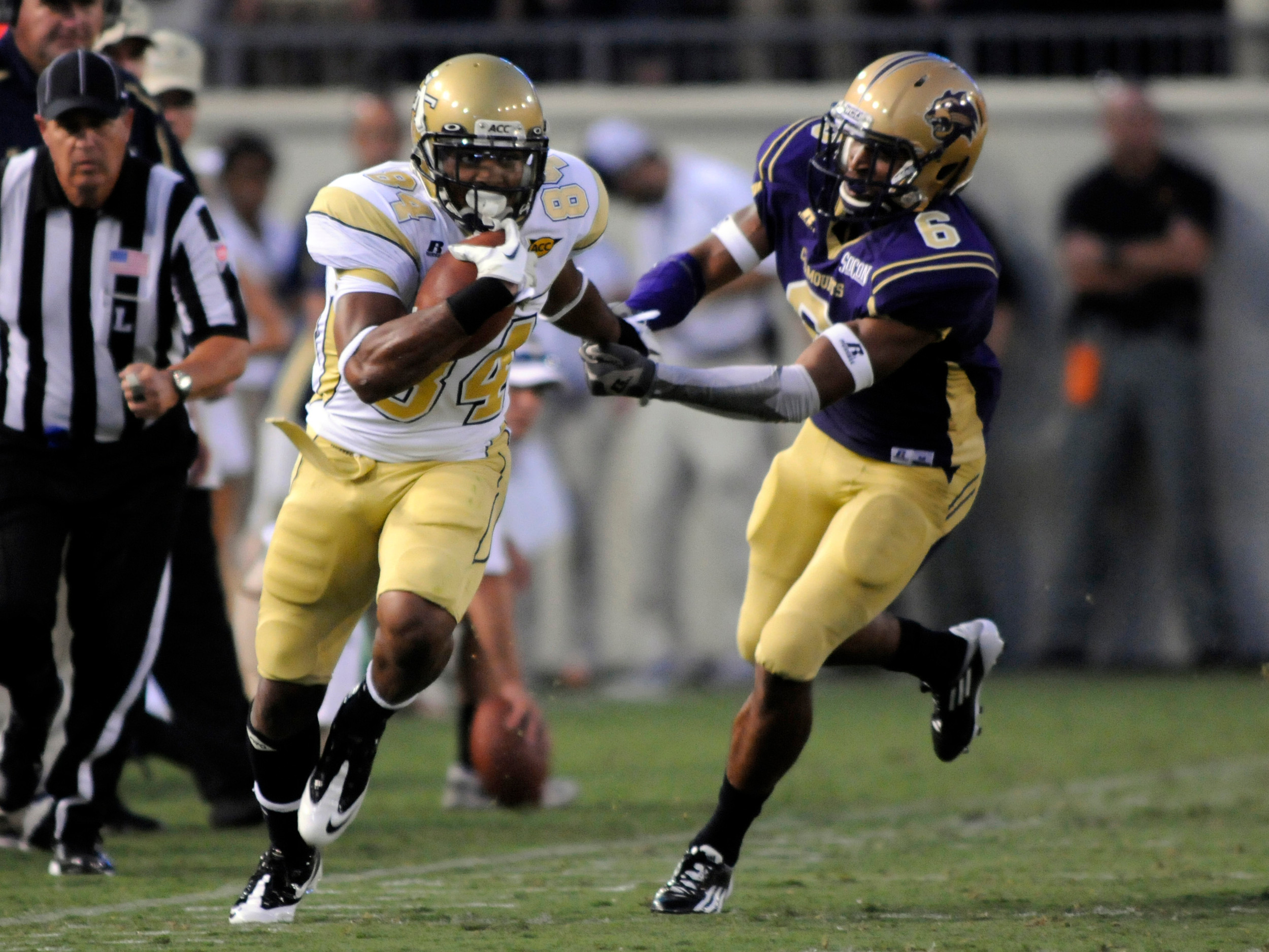 Georgia Tech wide receiver Tyler Melton, left, runs past Western Carolina's Dee Williams after catching a pass during an NCAA college football in Atlanta, Thursday, Sept. 1, 2011. AP Photo/Billy Weeks)