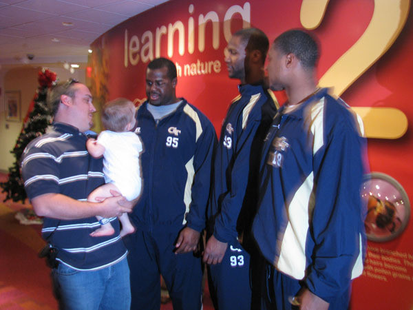 Yellow Jackets visit children at Egleston Hospital.