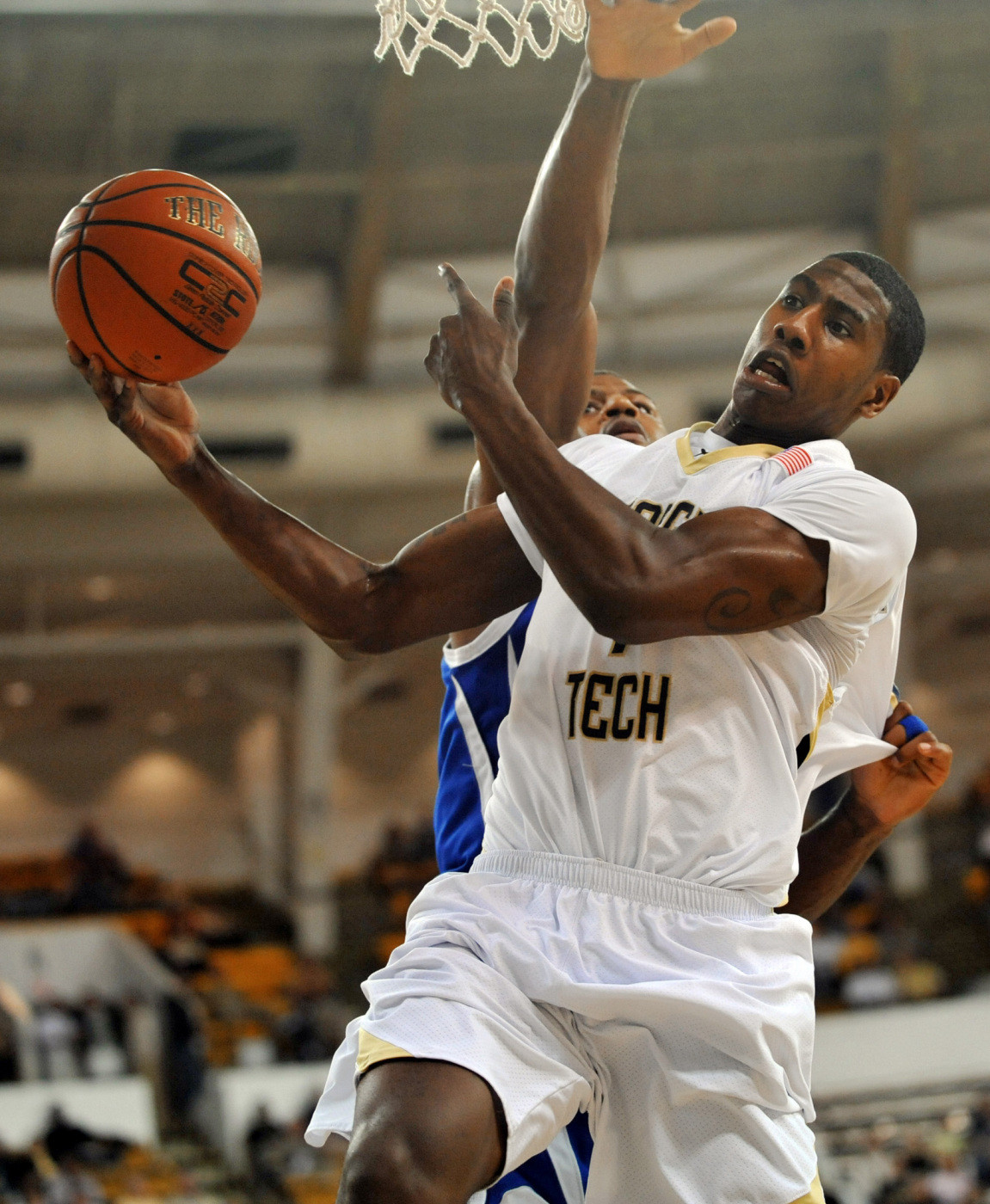 Iman Shumpert is fouled by Rashad Chase on a shot during the first half.