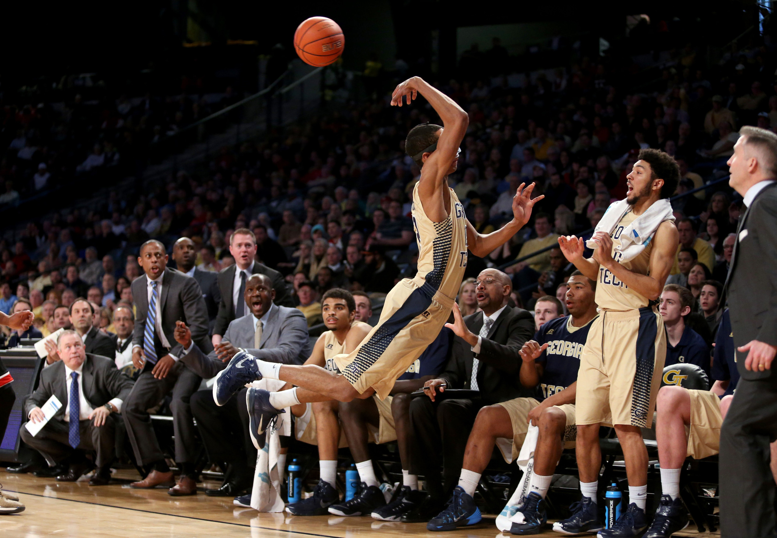 Quinton Stephens dives for a loose ball as guard Josh Heath reacts. Jason Getz-USA TODAY Sports