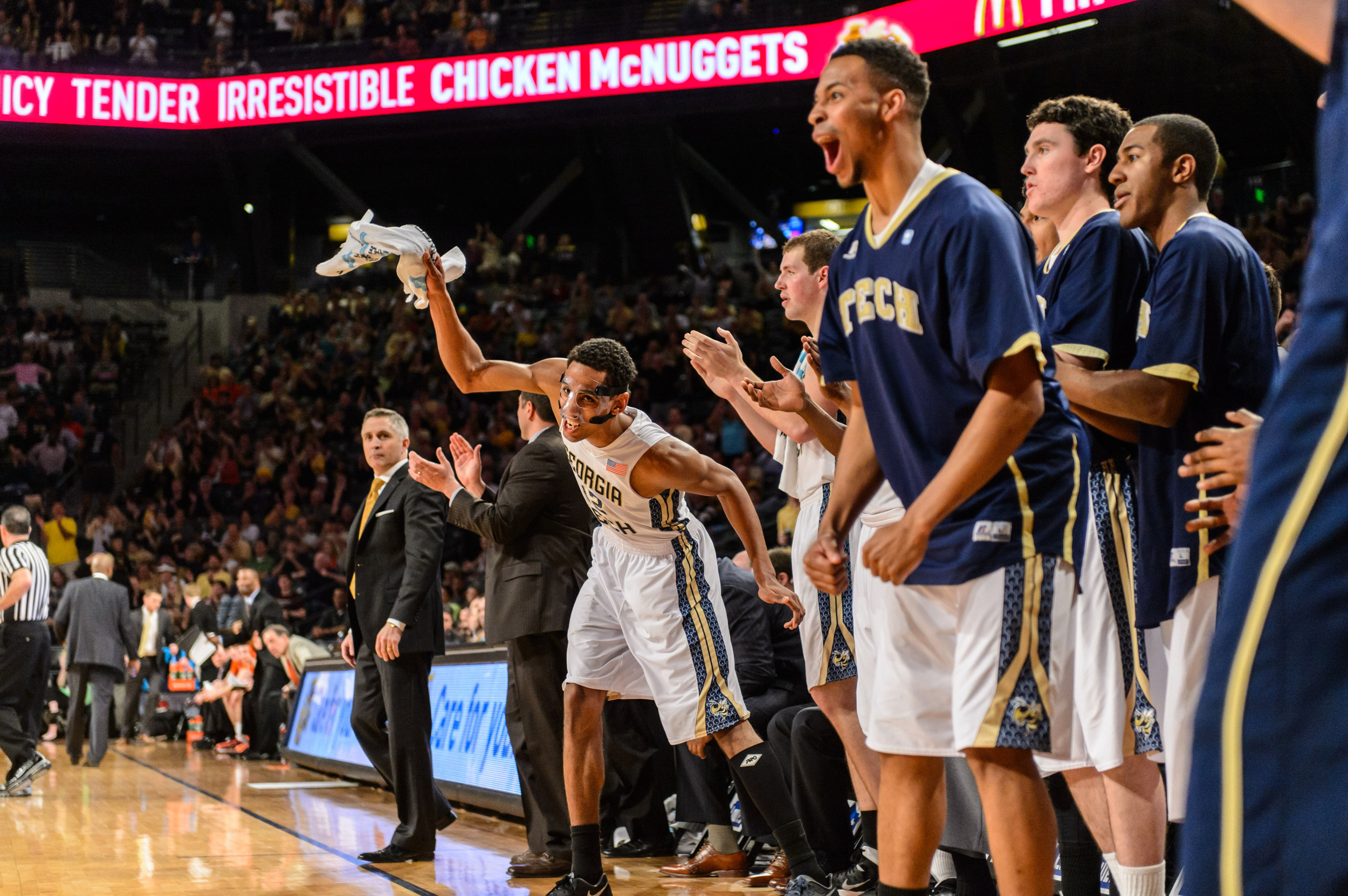 Quinton Stephens (12) and the GT bench react to the play