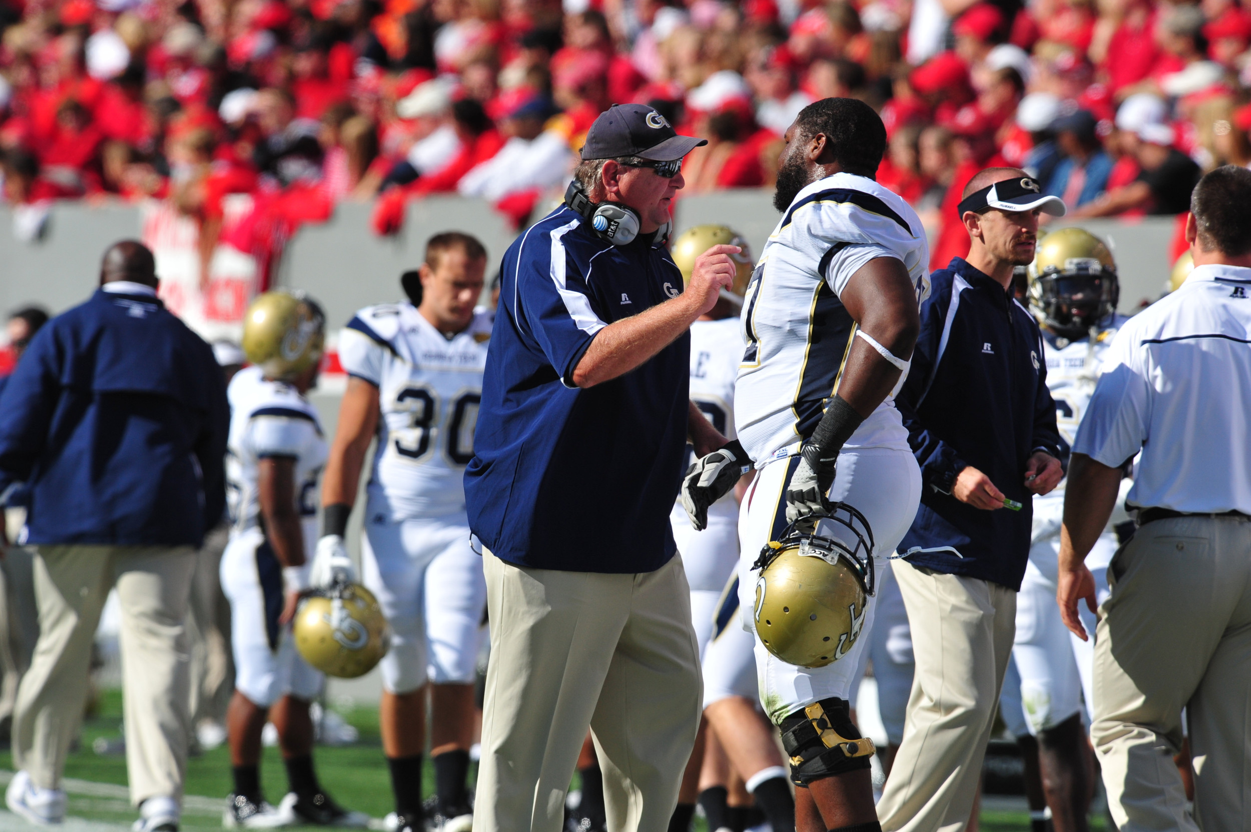 Georgia Tech at NCSUOctober 1, 2011Georgia Tech offensive guard Omoregie Uzzi and Coach Sewak talk after GT scores a touchdown.Photo by LensEffects