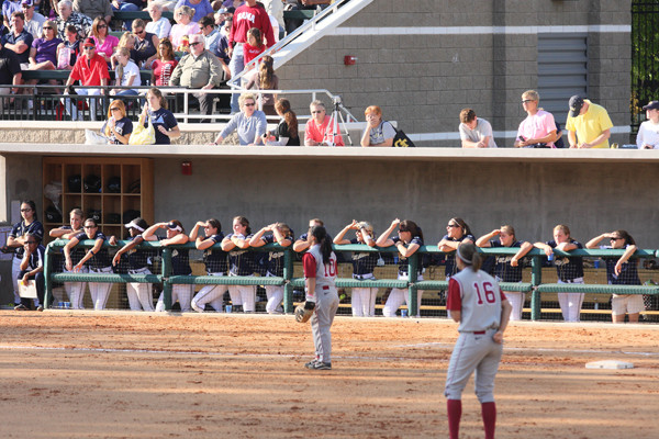 Dugout looks on