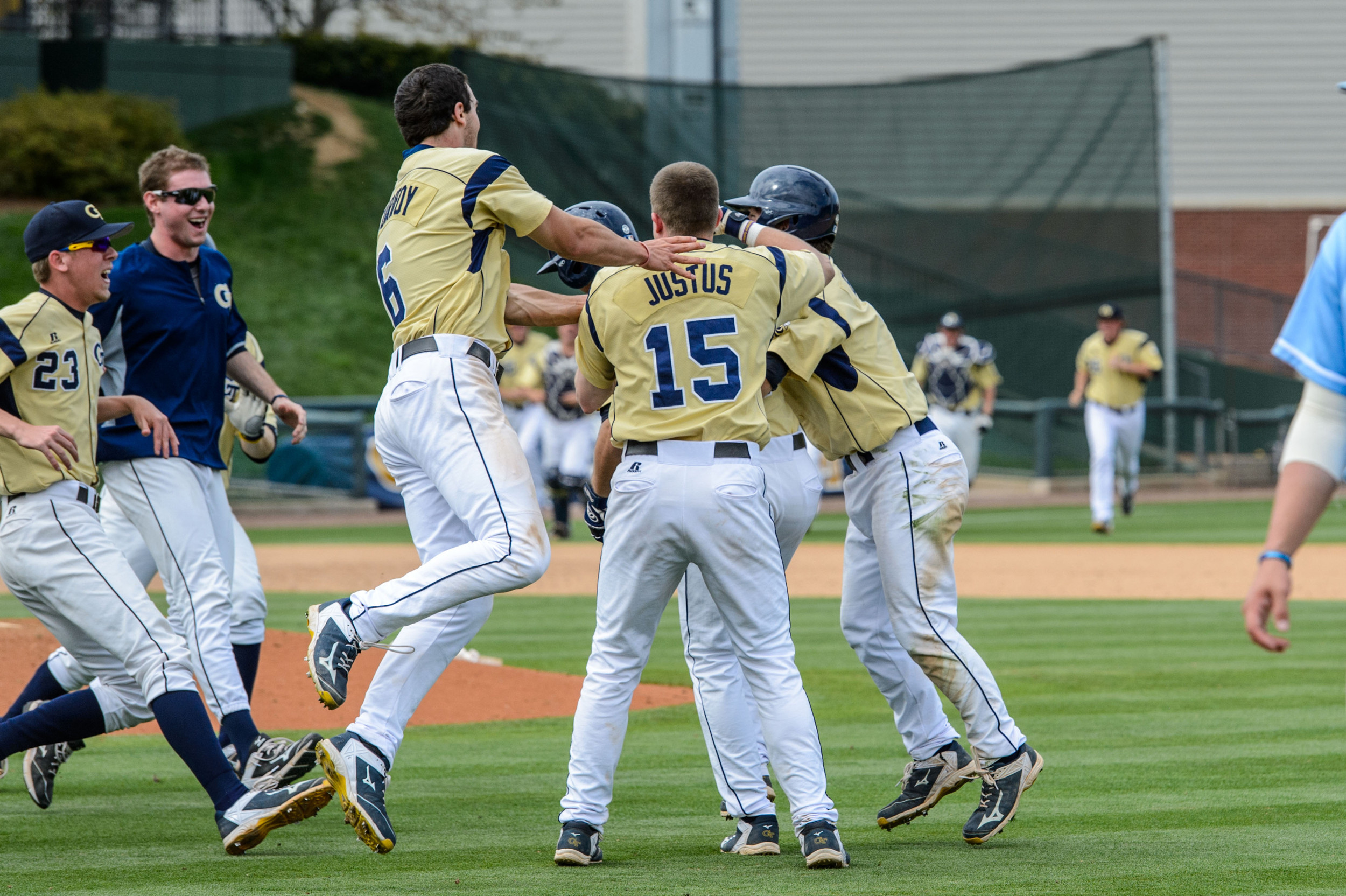 Thomas Smith is swarmed by the team after his walk-off single