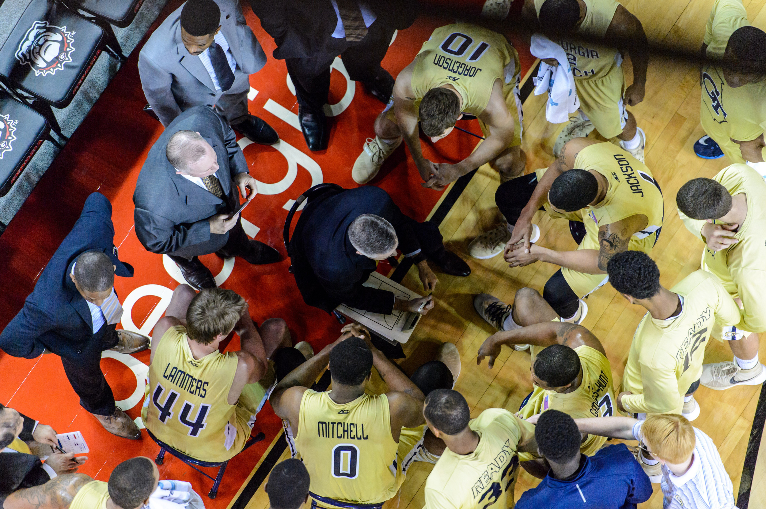 Coach Gregory speaks to the team during a timeout