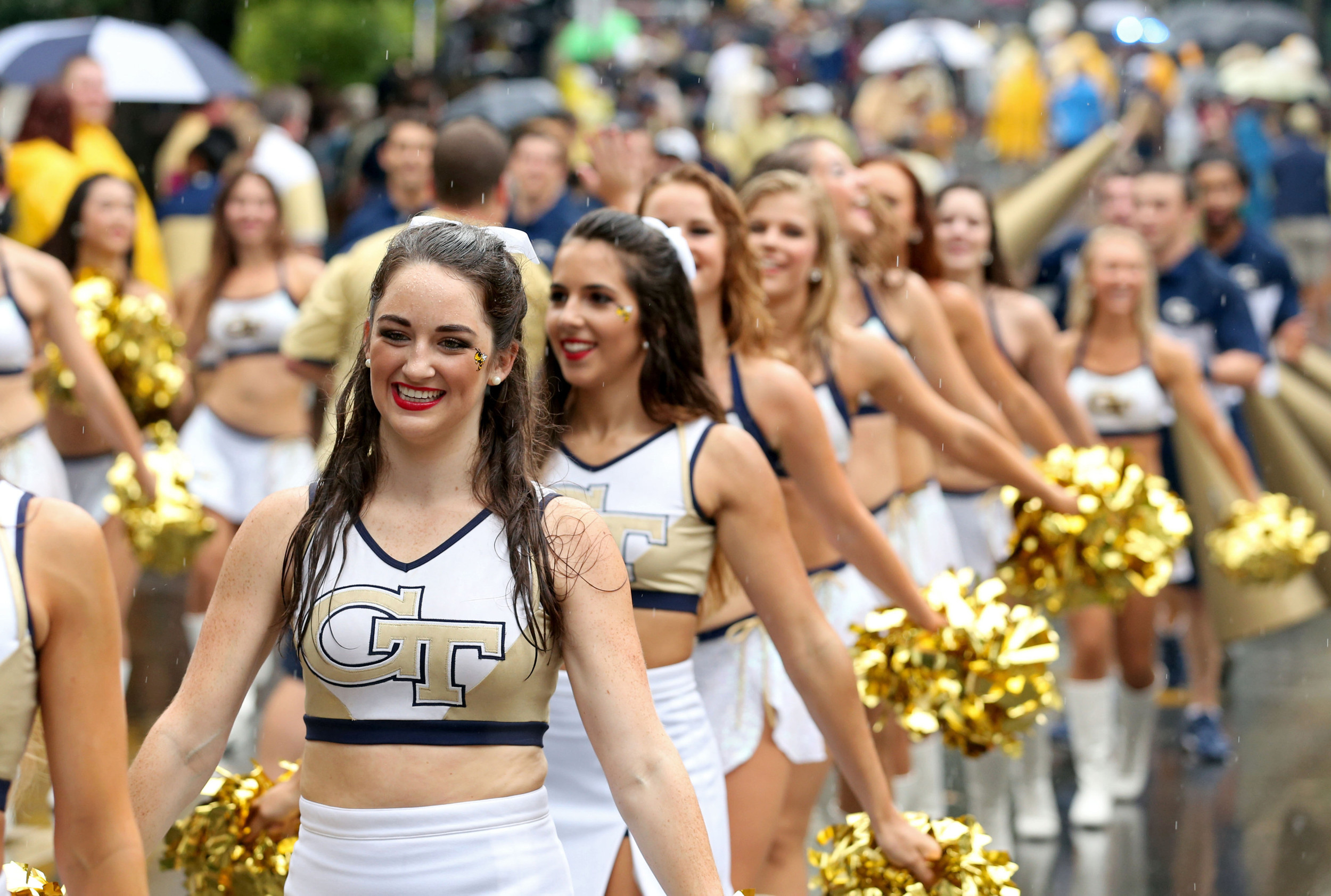 Yellow Jackets cheerleaders walk toward Bobby Dodd Stadium before the Jackets' game against Alcorn State. Credit: Jason Getz-USA TODAY Sports