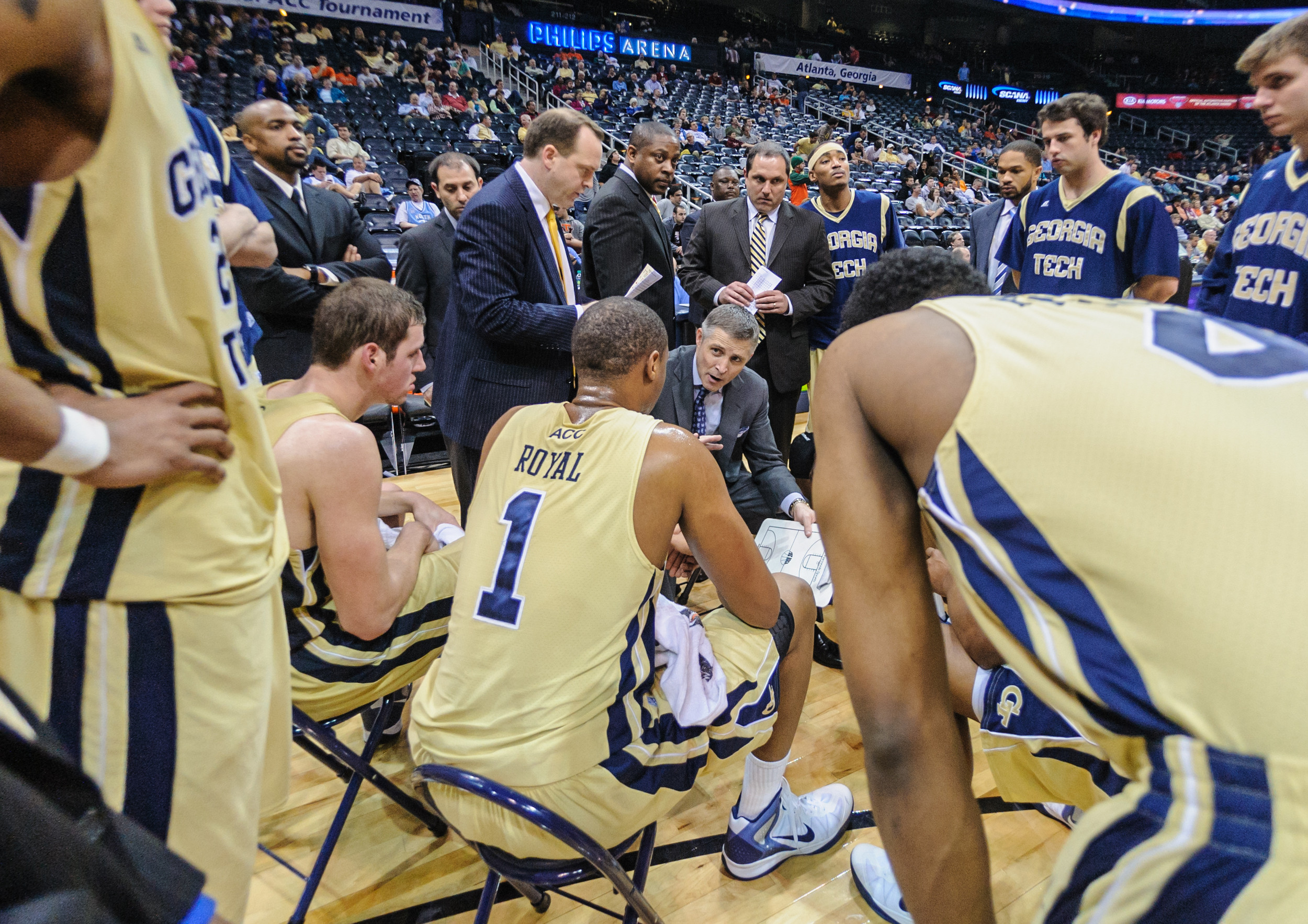 Coach Brian Gregory speaks to the team during a timeout.