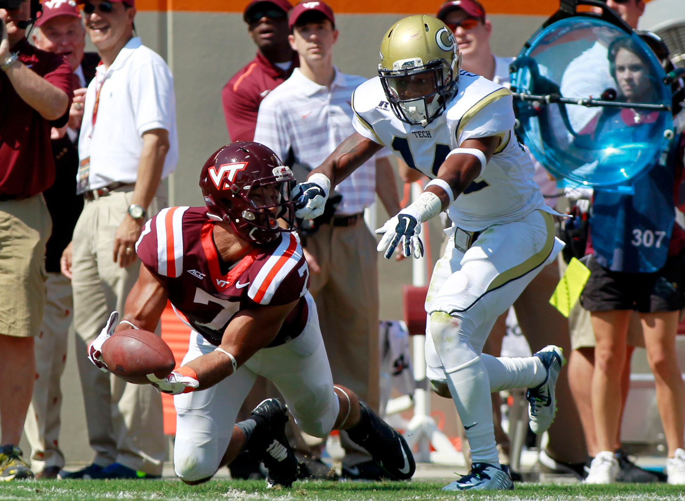 Hokies tight end Bucky Hodges has his face mask grab by defensive back Corey Griffin while trying to make a catch during the first quarter at Lane Stadium. Peter Casey-USA TODAY Sports