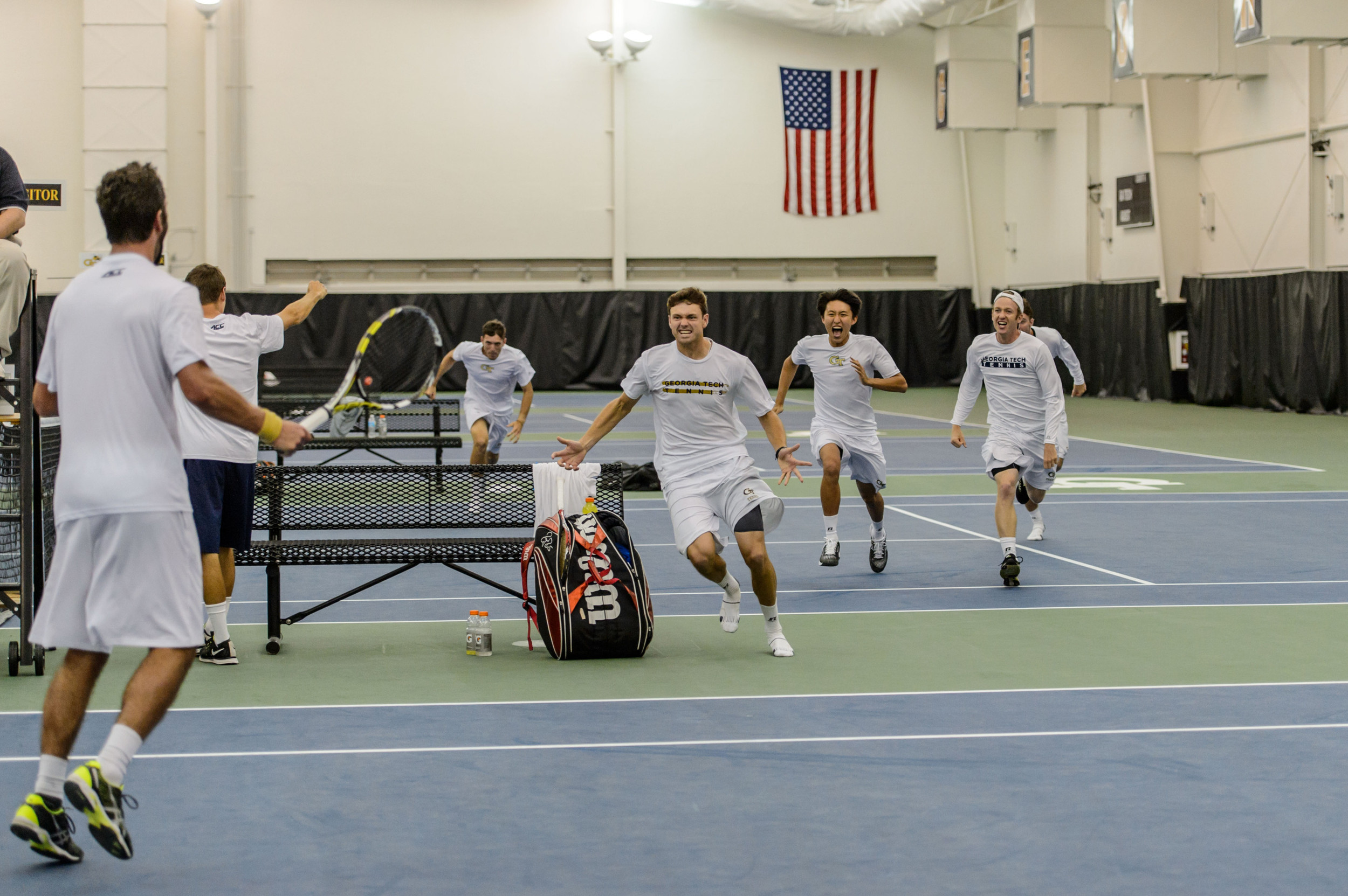 Jackets mob Carlos Benito after his clinching victory over Duke
