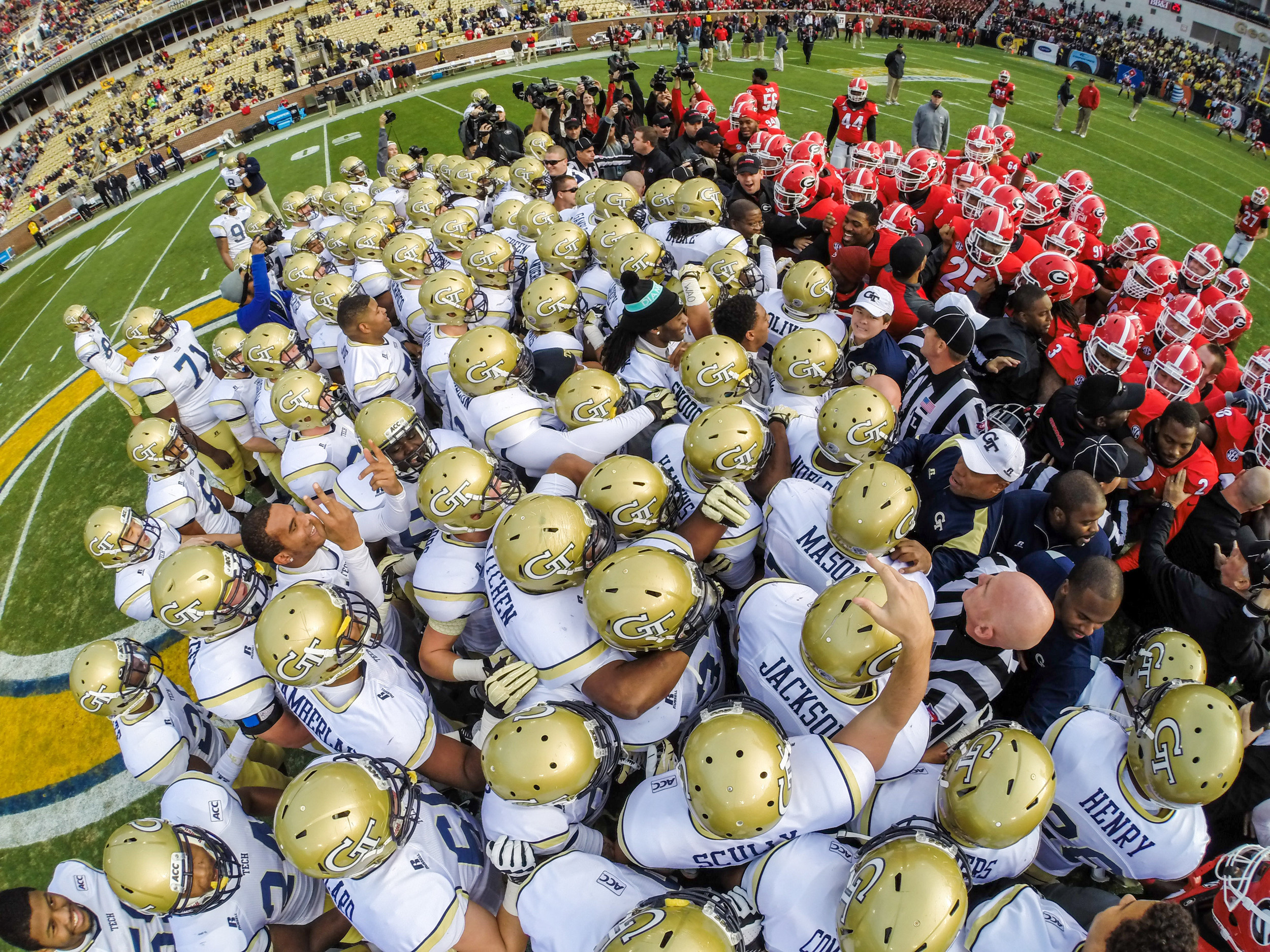 The teams meet at midfield prior to the game.