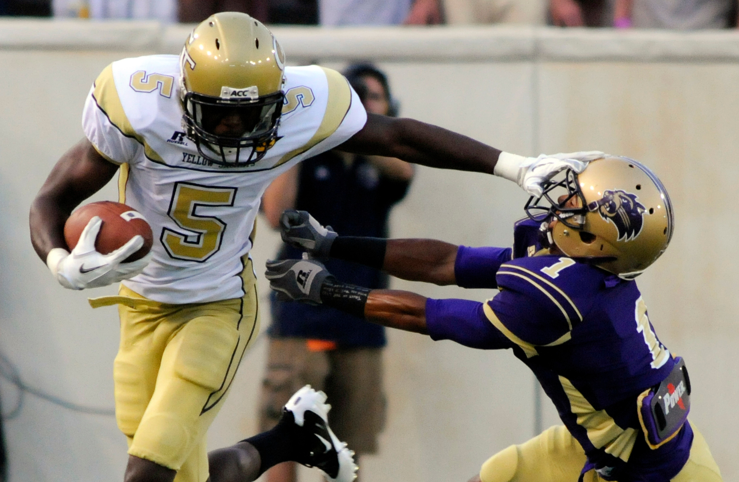 Georgia Tech wide receiver Stephen Hill, left, runs past Western Carolina defensive back Elijer Martinez for a touchdown during an NCAA college football in Atlanta, Thursday, Sept. 1, 2011. AP Photo/Billy Weeks)