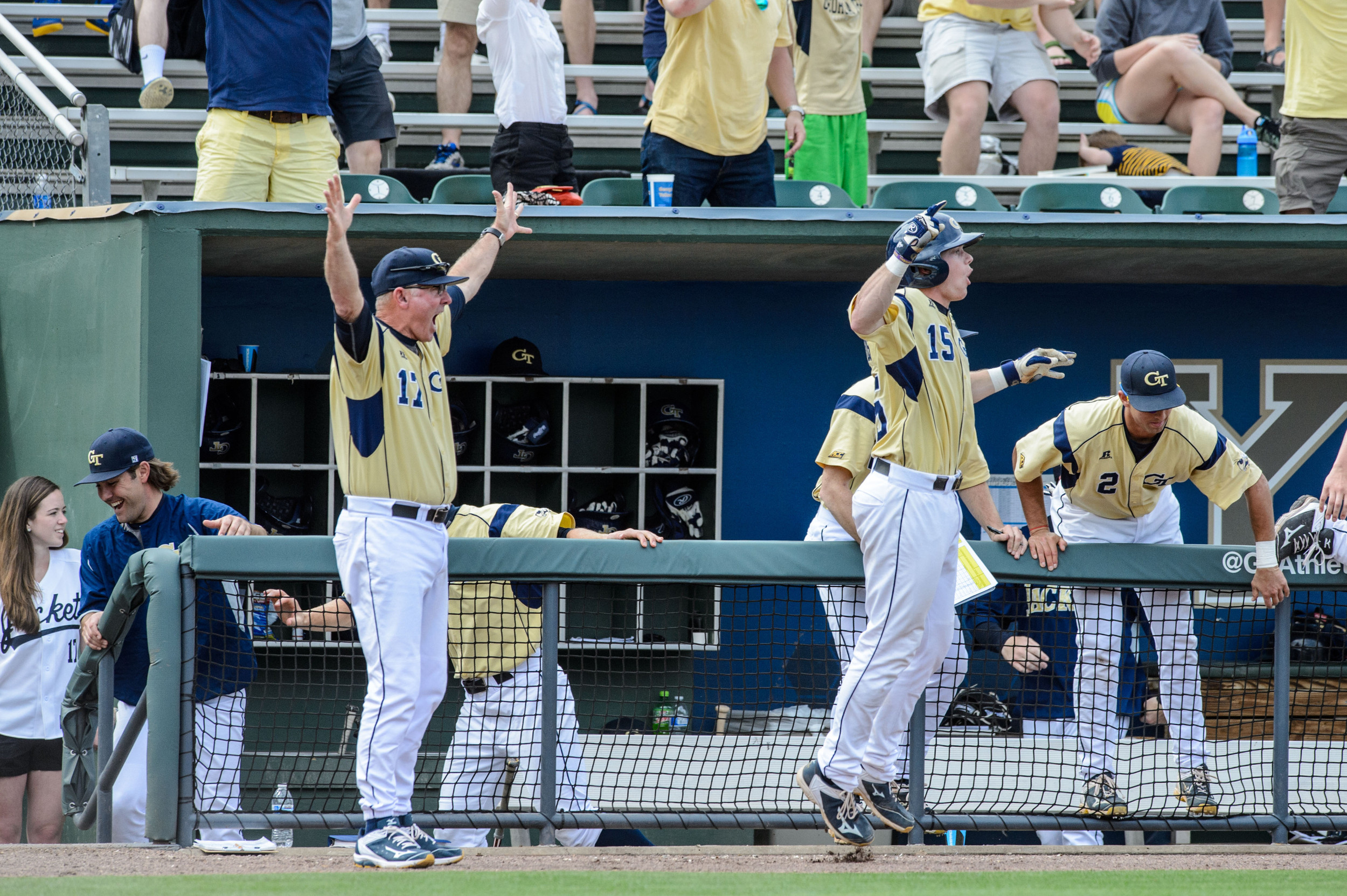 Coach Danny Hall (17) celebrates while Connor Justus (15) leaps for joy after Thomas Smith's walk-off
