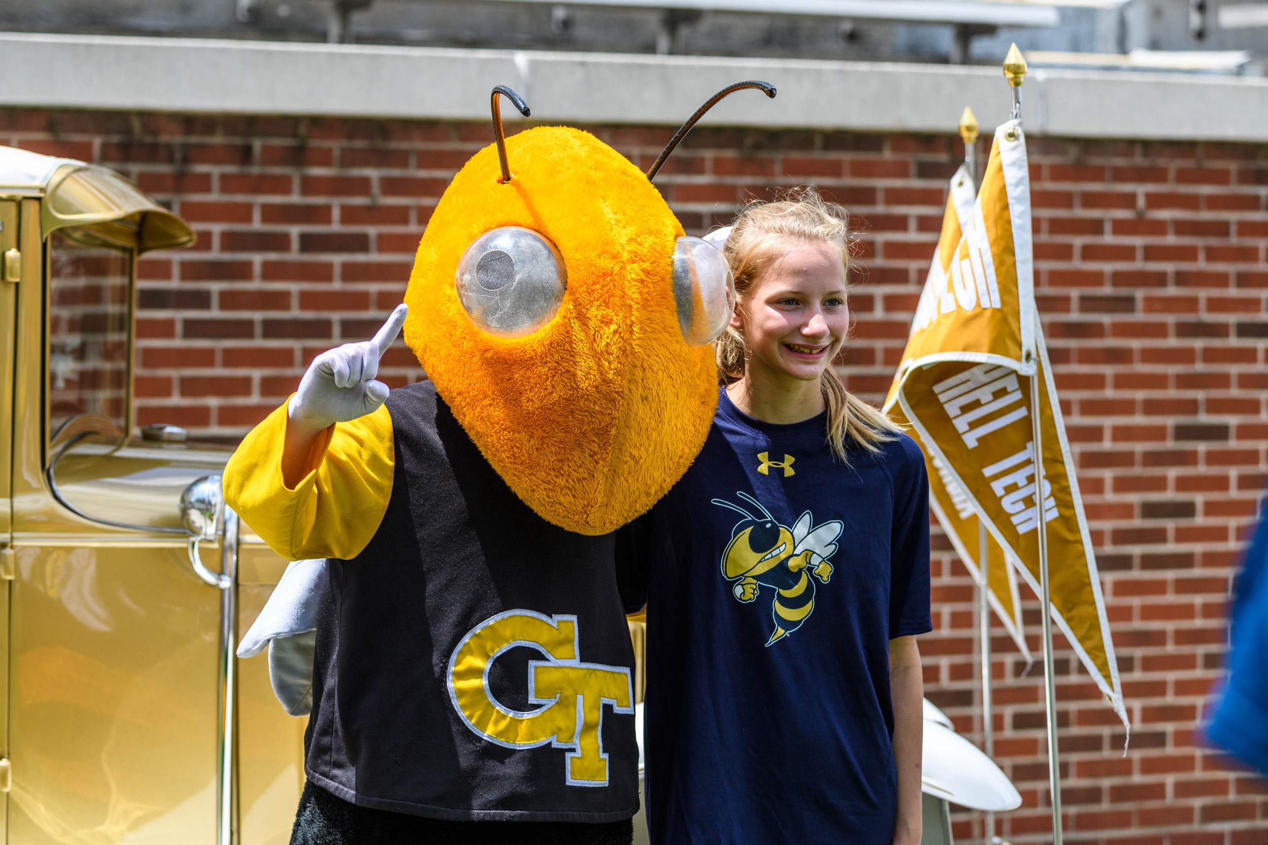 Buzz poses with a fan in front of the Reck