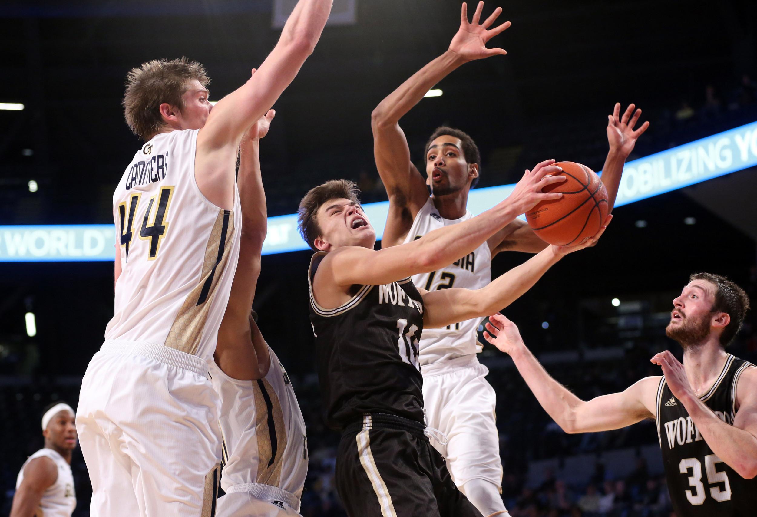 Wofford Terriers guard Nathan Hoover (10) drives against Yellow Jackets center Ben Lammers (44) and forward Quinton Stephens (12) in the second half of their game at McCamish Pavilion. Georgia Tech won 76-72. Credit: Jason Getz-USA TODAY Sports