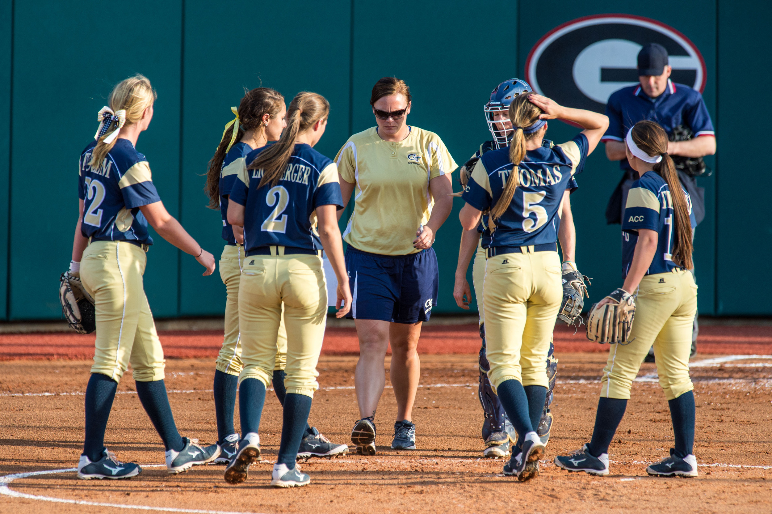 Assistant Coach Charlotte Morgan comes out to speak to the infield