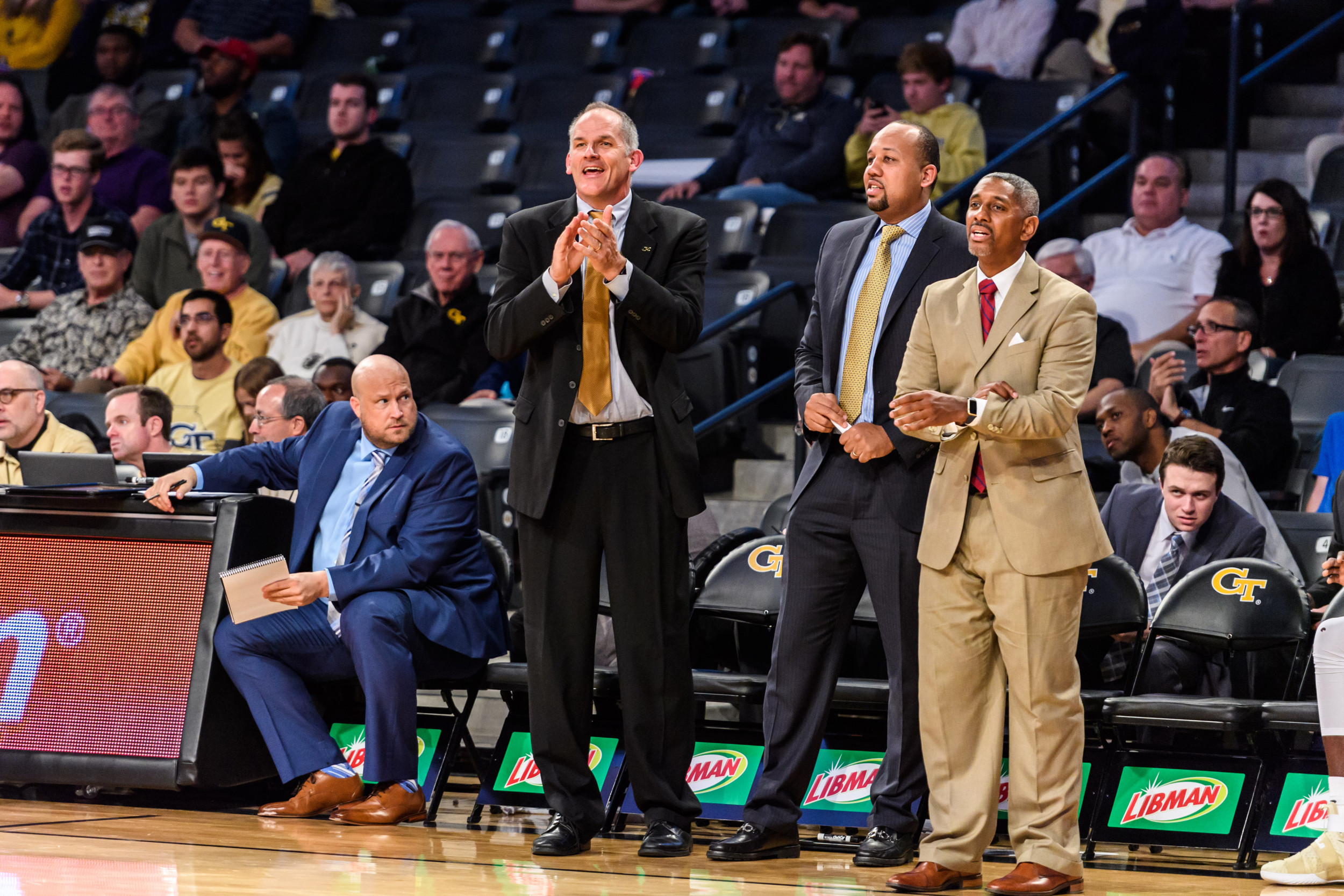Assistant Coaches Tavaras Hardy, Darryl LaBarrie, and Eric Reveno