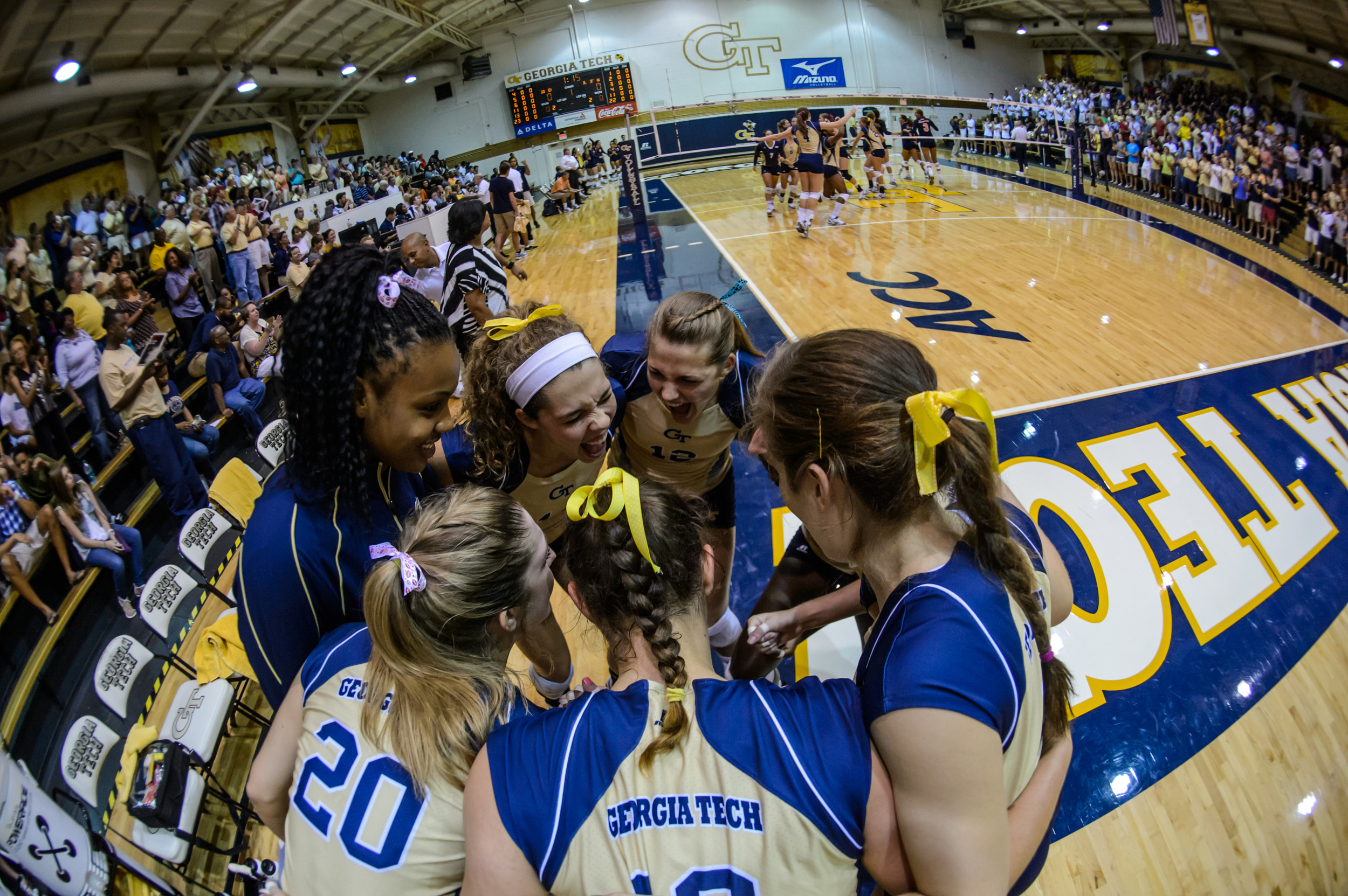 The non-starters huddle before the start of the match.