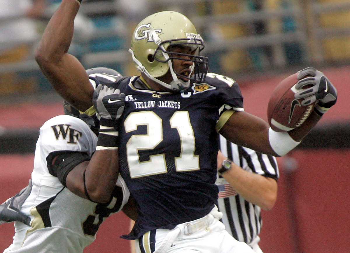 Georgia Tech receiver Calvin Johnson, right, is tackled in the first quarter by Wake Forest defender Chip Vaughn during the ACC Championship game, Saturday, Dec. 2, 2006, in Jacksonville, FLa. (AP Photo/Phil Coale)