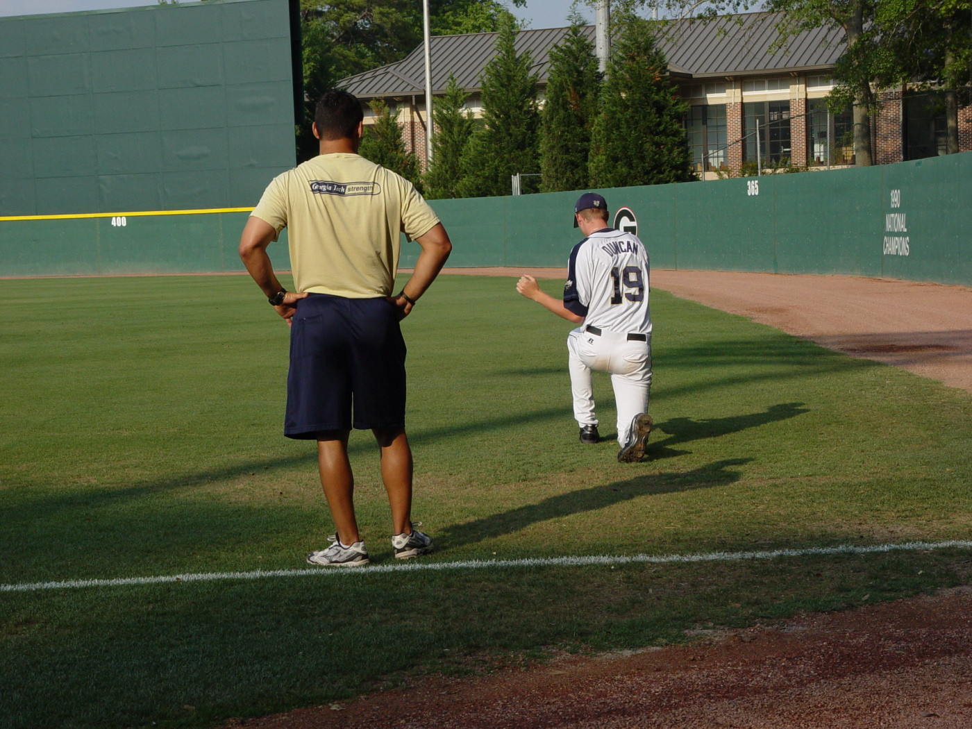 Strength coach Steve Tamborra watches pitcher David Duncan loosen up before Tech meets Louisville in the NCAA baseball regional, May 30, 2008.