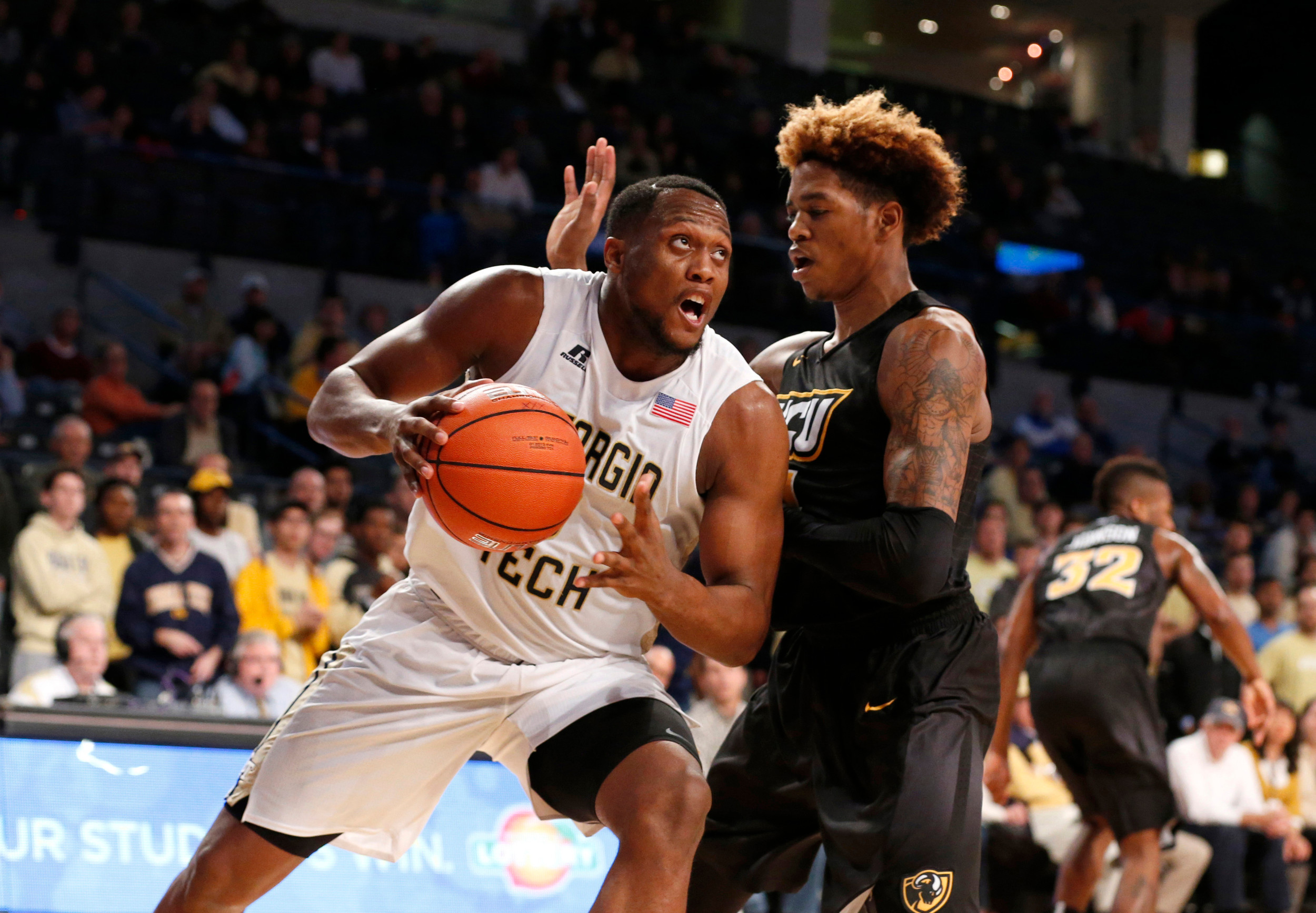 Georgia Tech forward Charles Mitchell dribbles the ball as Virginia Commonwealth Rams forward Justin Tillman defends in the second half of their game at McCamish Pavilion. Credit: Jason Getz-USA TODAY Sports