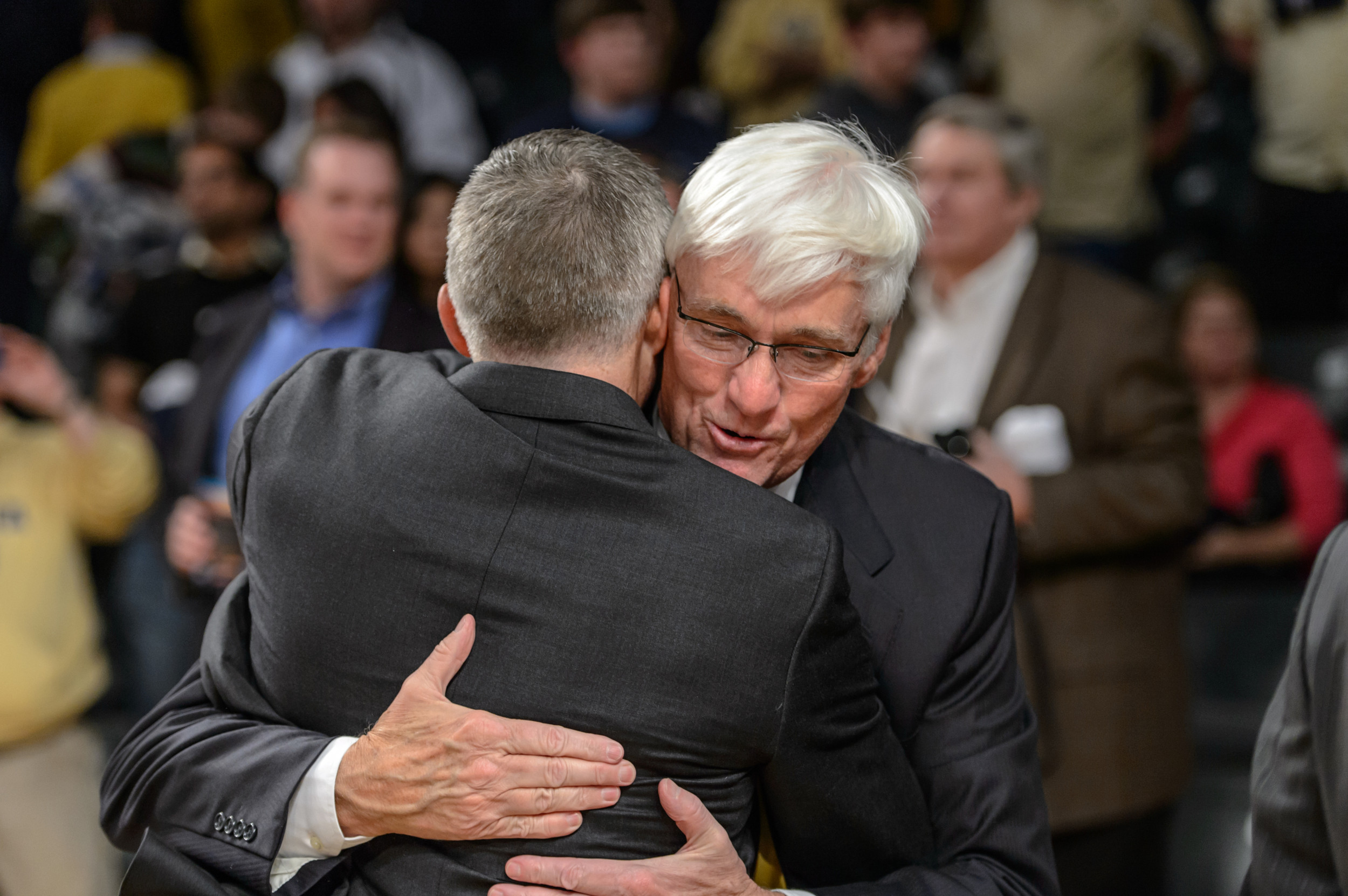 Brian Gregory and Bobby Cremins embrace after the win.