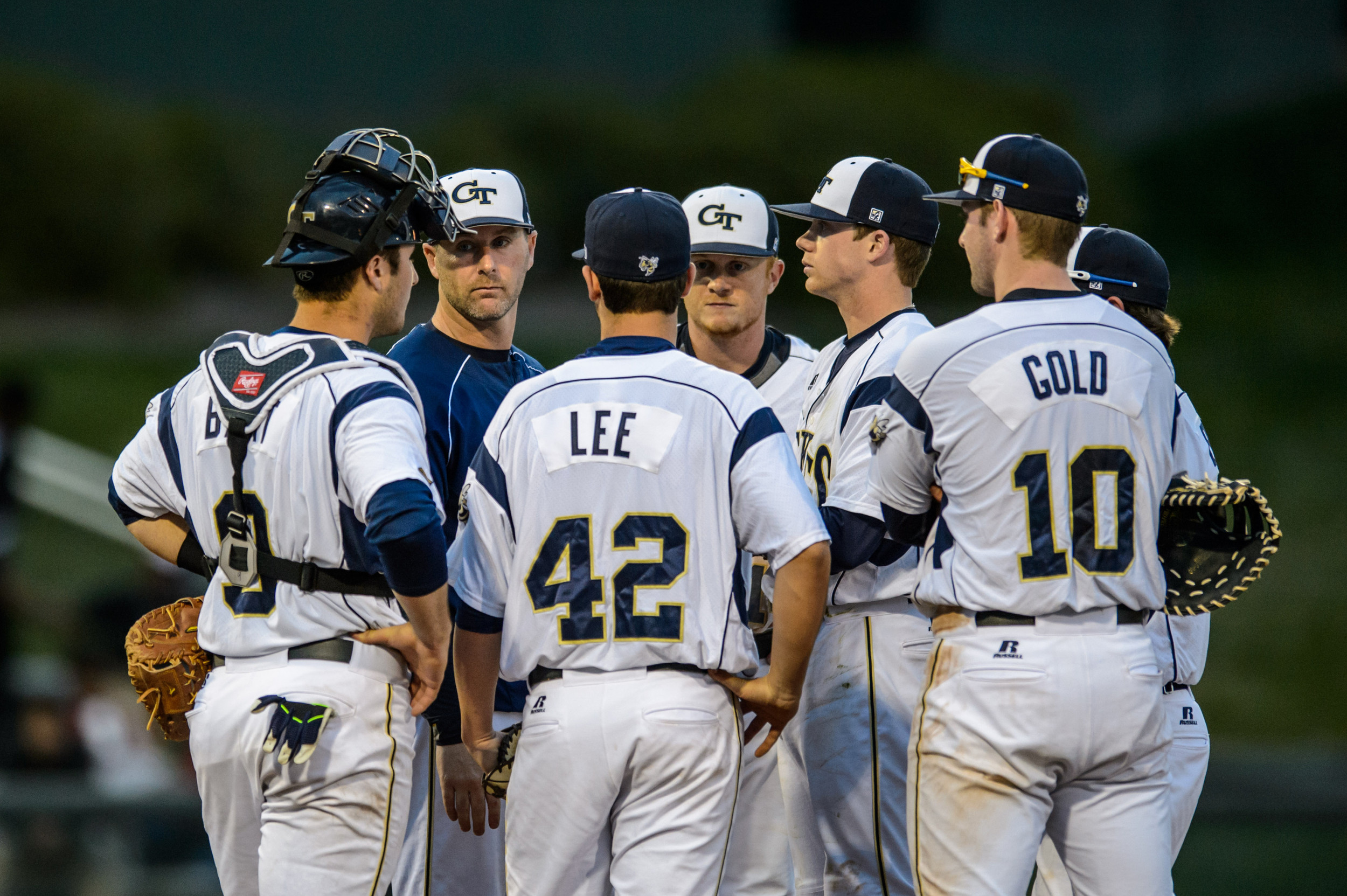 Pitching Coach Jason Howell (34) speaks to the infield