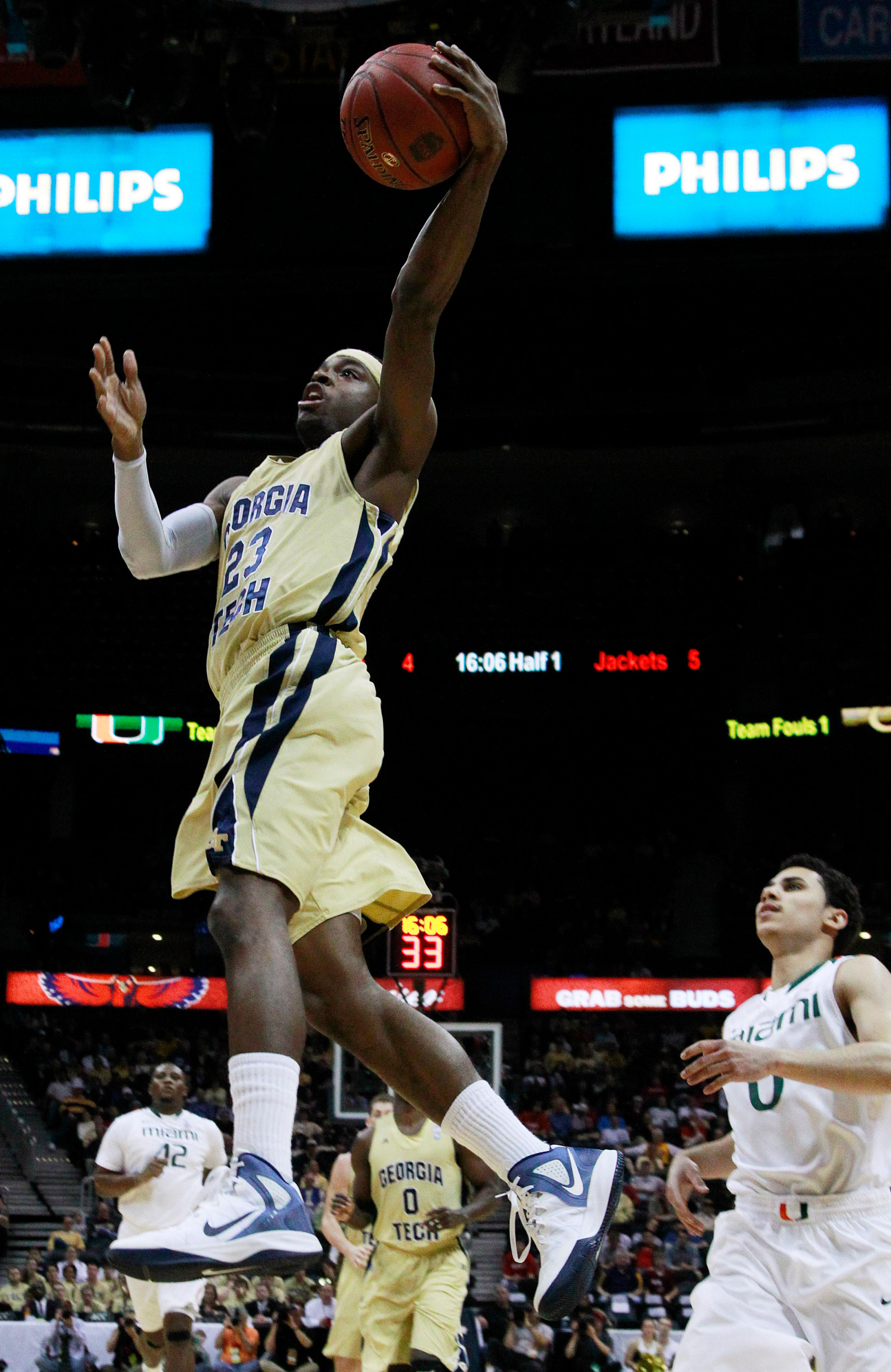 Georgia Tech guard Brandon Reed (23) heads to the basket as Miami guard Shane Larkin (0) looks on during the first half. (AP Photo/John Bazemore)