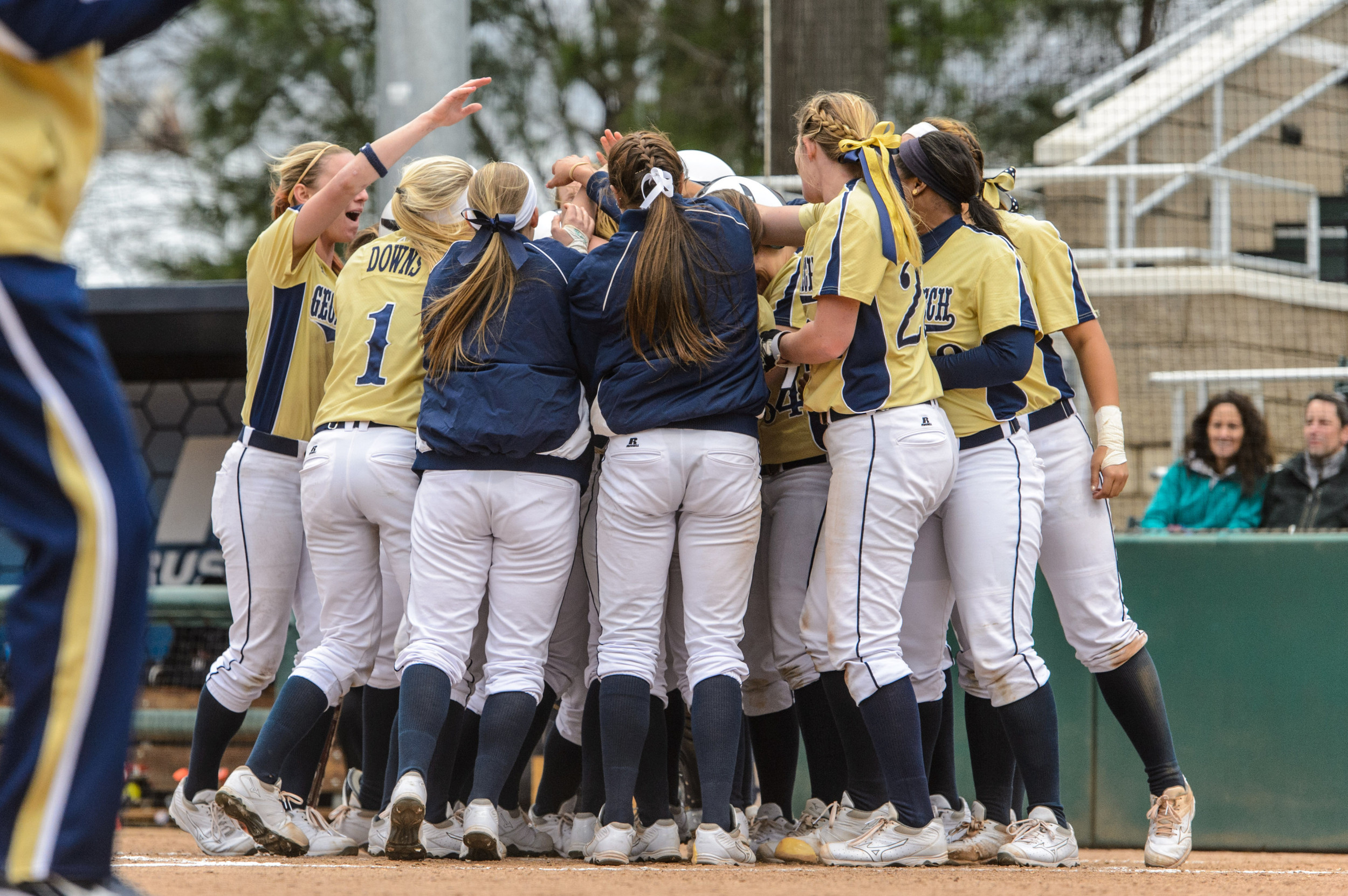 Colleen Darragh (24) is welcomed at the plate by the team after hitting a walk-off grand slam!