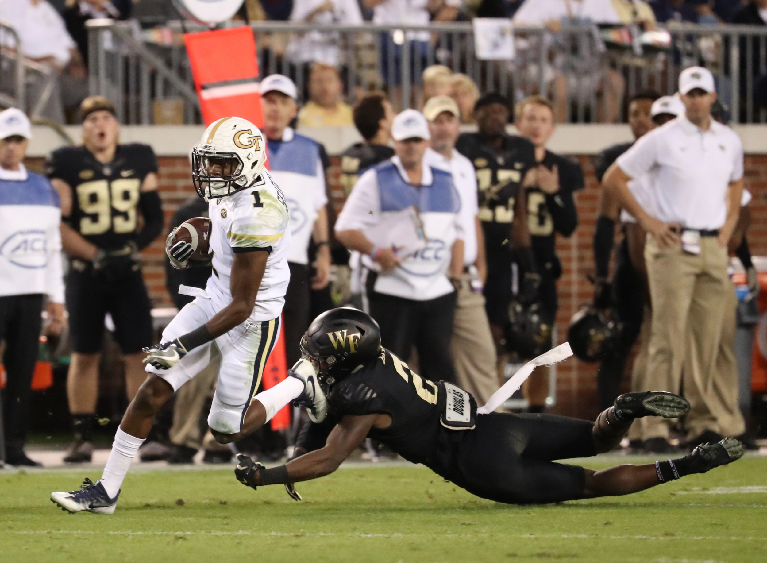 Oct 21, 2017; Atlanta, GA, USA; Georgia Tech Yellow Jackets running back Qua Searcy (1) gets past Wake Forest Demon Deacons defensive back Cameron Glenn (2) for a long touchdown run in the third quarter at Bobby Dodd Stadium. Mandatory Credit: Jason Getz-USA TODAY Sports